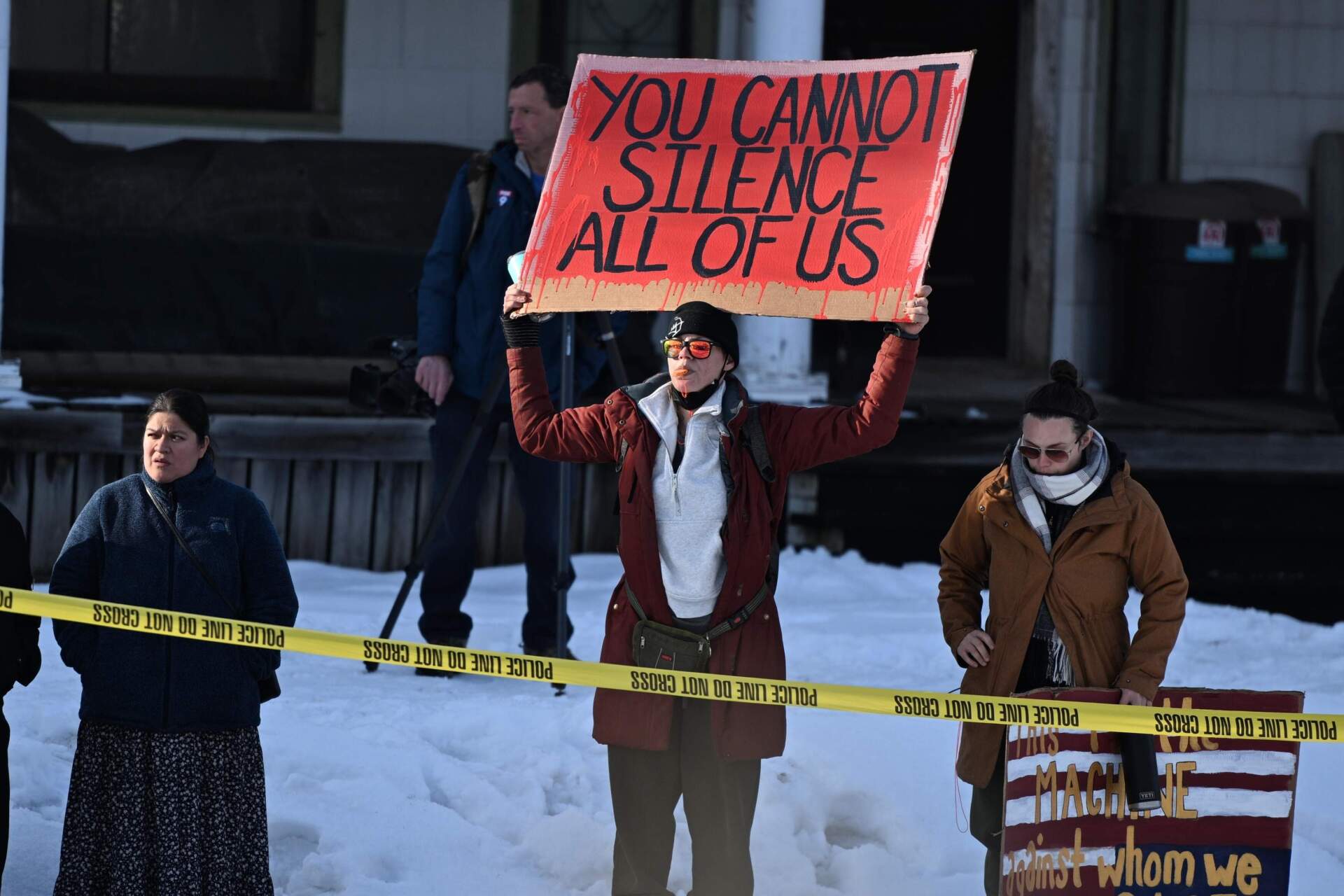 People protest at the scene of the shooting on Wednesday in Minneapolis. (Tom Baker/AP)