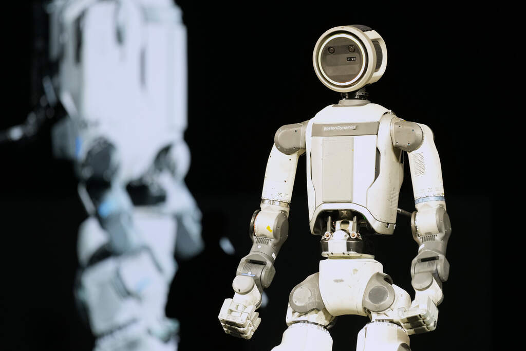 An Atlas robot stands on the stage during a Hyundai and Boston Dynamics news conference. (Abbie Parr/AP)