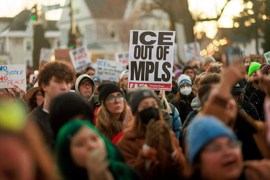 People demonstrate against ICE during a vigil honoring a woman who was shot and killed by an immigration officer earlier in the day in Minneapolis, Minnesota, on January 7, 2026. (Kerem Yucel / AFP via Getty Images)