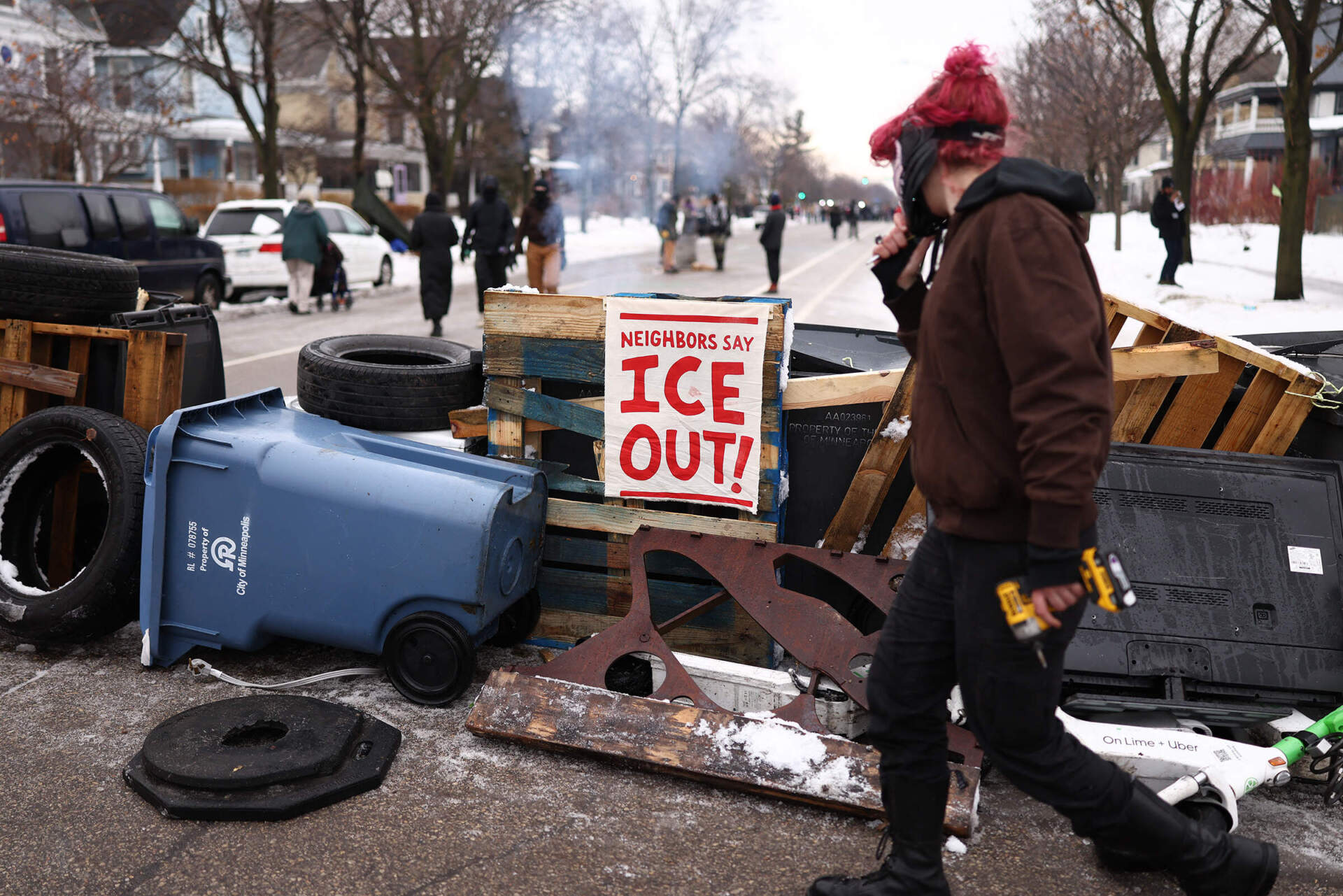 Demonstrators gather on Thursday at the street where 37-year-old Renee Nicole Good was shot and killed. (Charly Triballeau/AFP via Getty Images)
