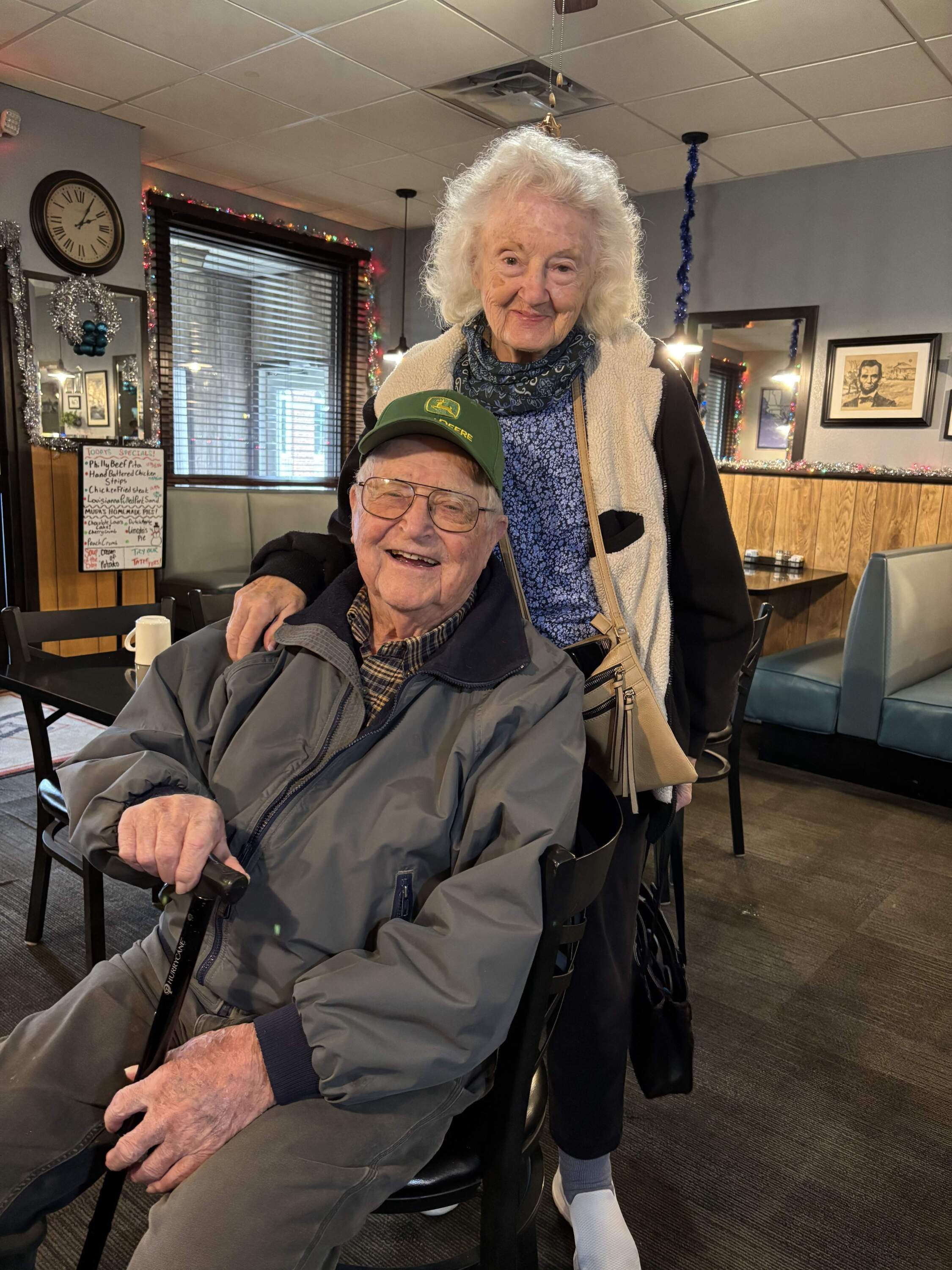 101-year-old Willard Simpson and his companion, 92-year-old Pauline Cultra at the Lincolnway Cafe, Franklin Grove, IL. (Courtesy of Amanda Merullo Photography)