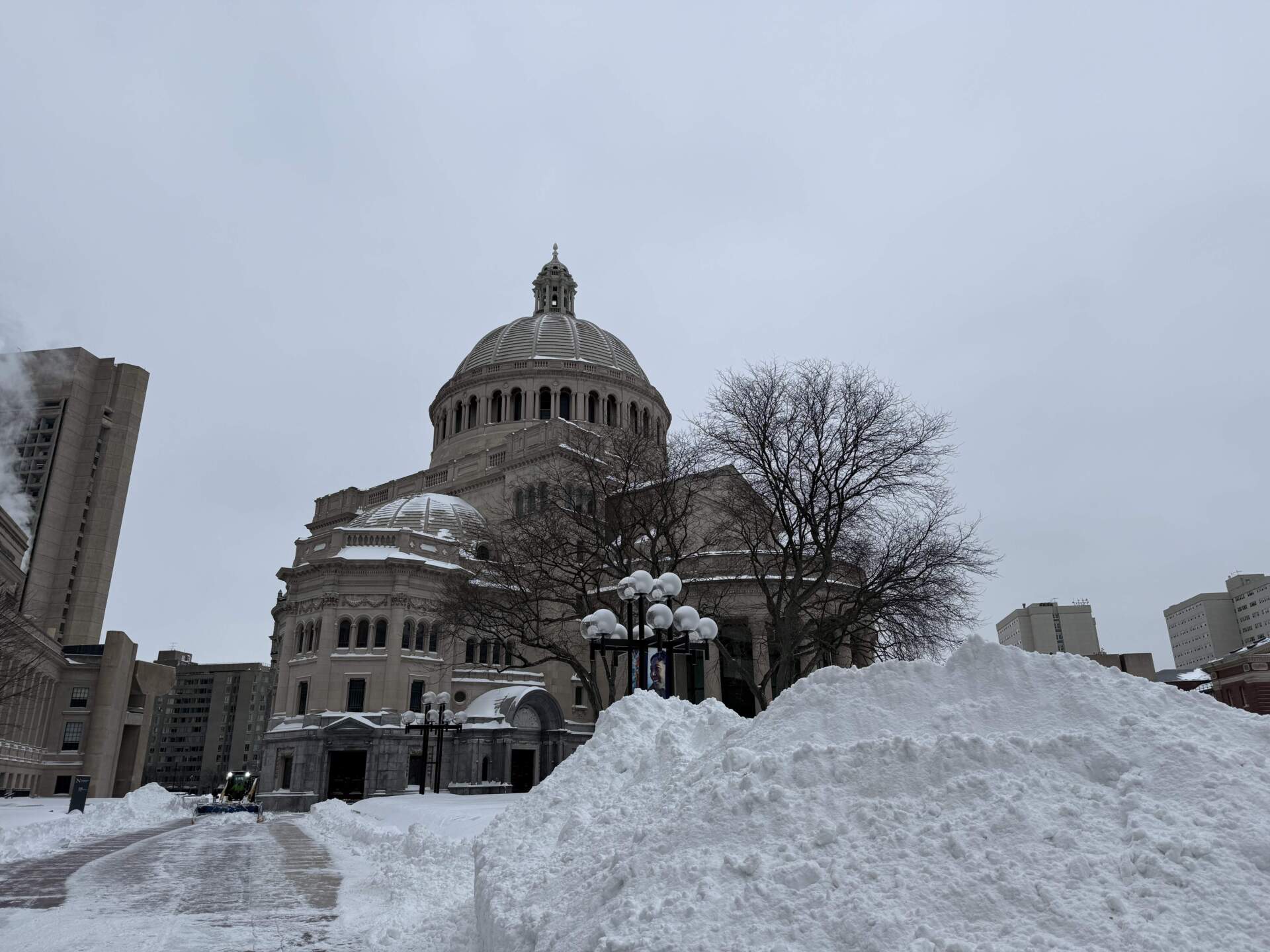 Workers clear the path to the Christian Science Plaza Monday morning. (Steven Davy/WBUR)