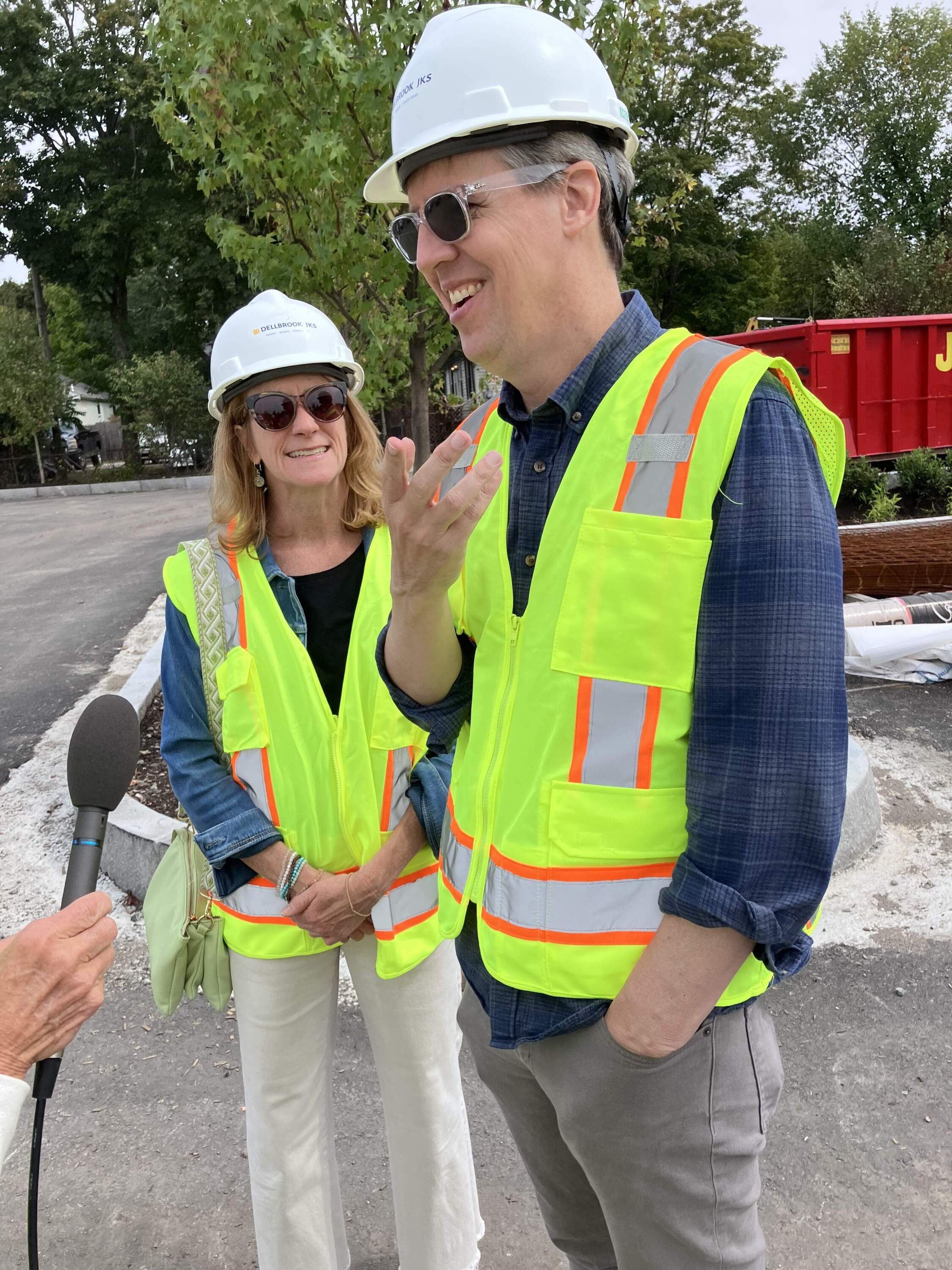 Julie Kinney (left) and Jeff Kinney (right) at the beer garden construction site in Plainville, Massachusetts. (Emiko Tamagawa/Here & Now)