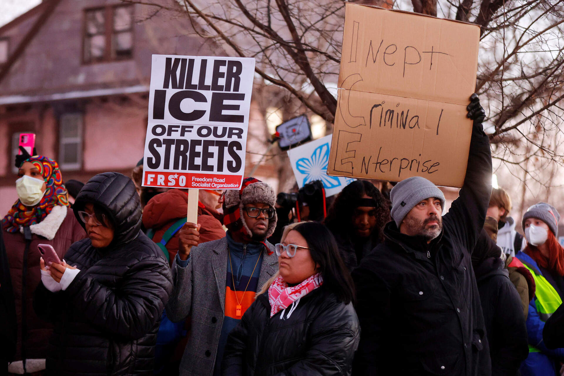 People gather for a vigil Wednesday evening in Minneapolis. (Bruce Kluckhohn/AP)