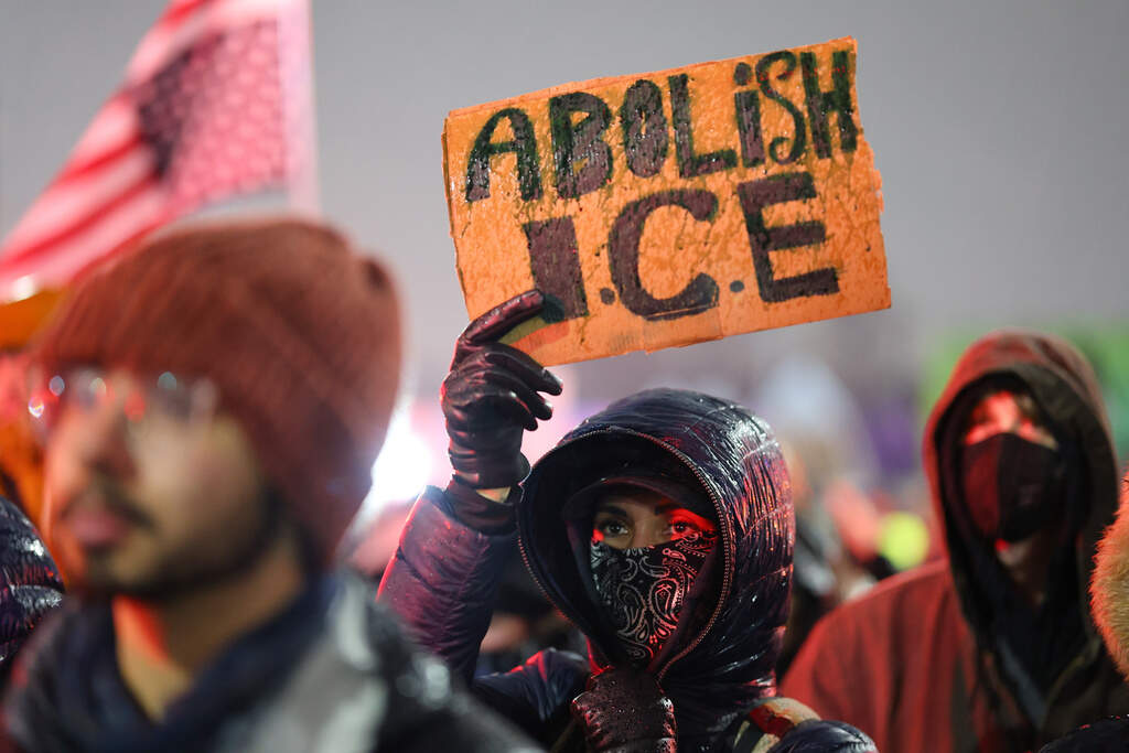 Protesters gather on Jan. 8 during a rally after Renee Macklin Good was fatally shot by an ICE officer in Minneapolis. (Adam Bettcher/AP)