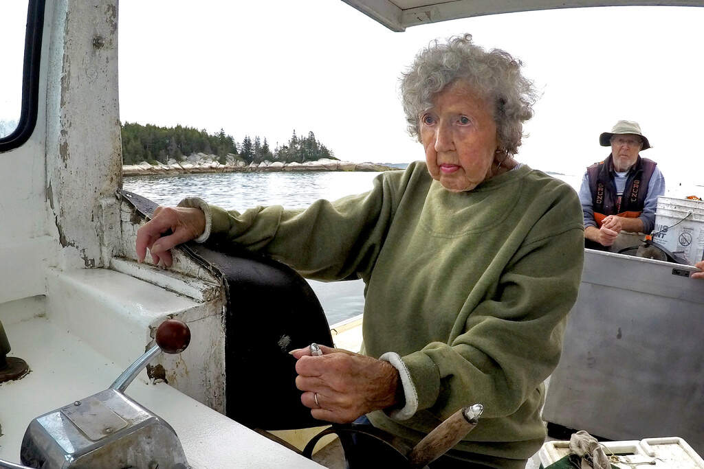 Virginia Oliver, then 101, pilots her son's boat, Aug. 31, 2021, off Rockland, Maine. (Robert F. Bukaty/AP)