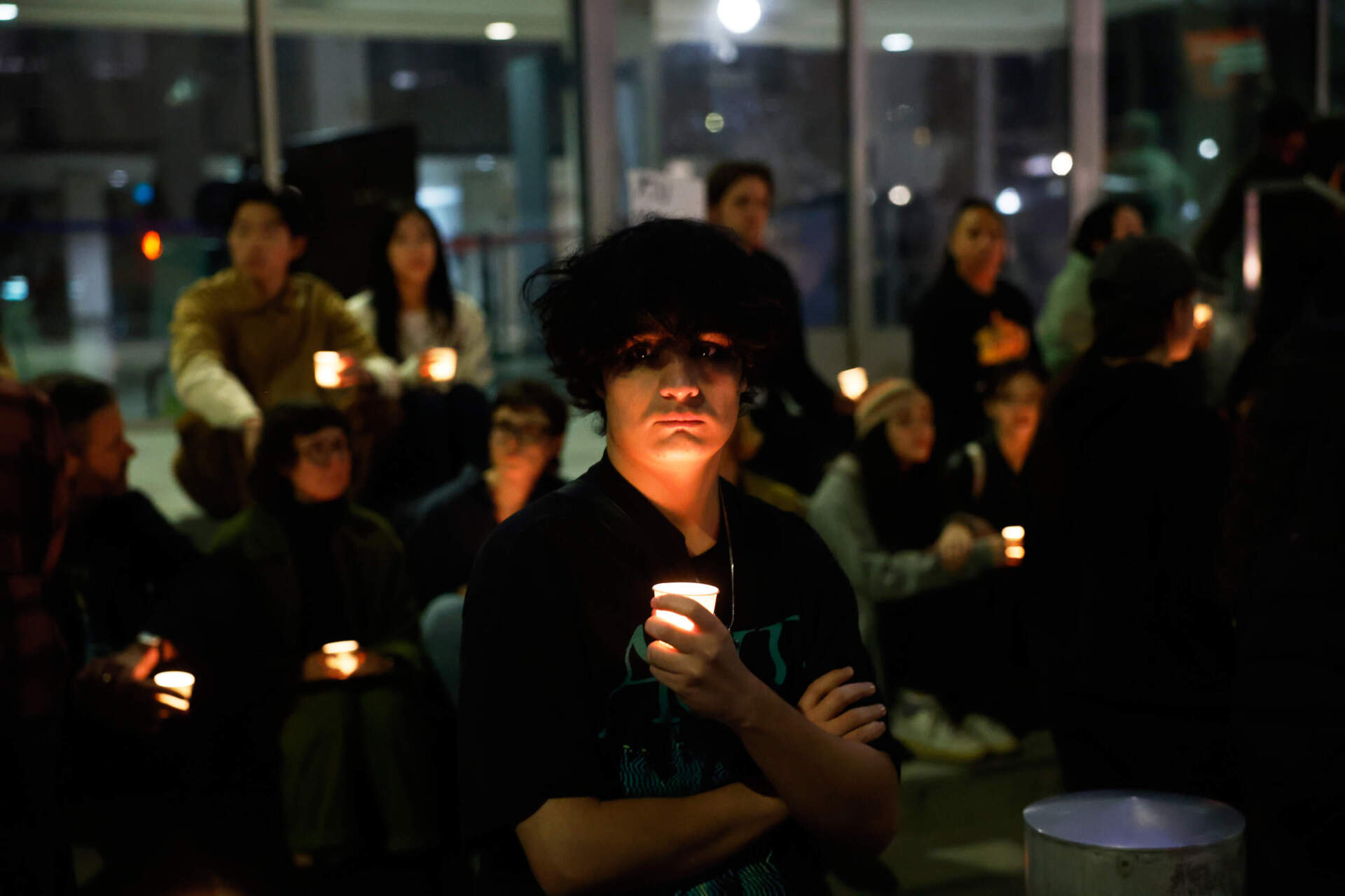 Demonstrators take part in a candlelight vigil during a protest in response to the fatal shooting of 37-year-old Alex Pretti in Minneapolis on Jan. 24 in Los Angeles. (Caroline Brehman/AP)