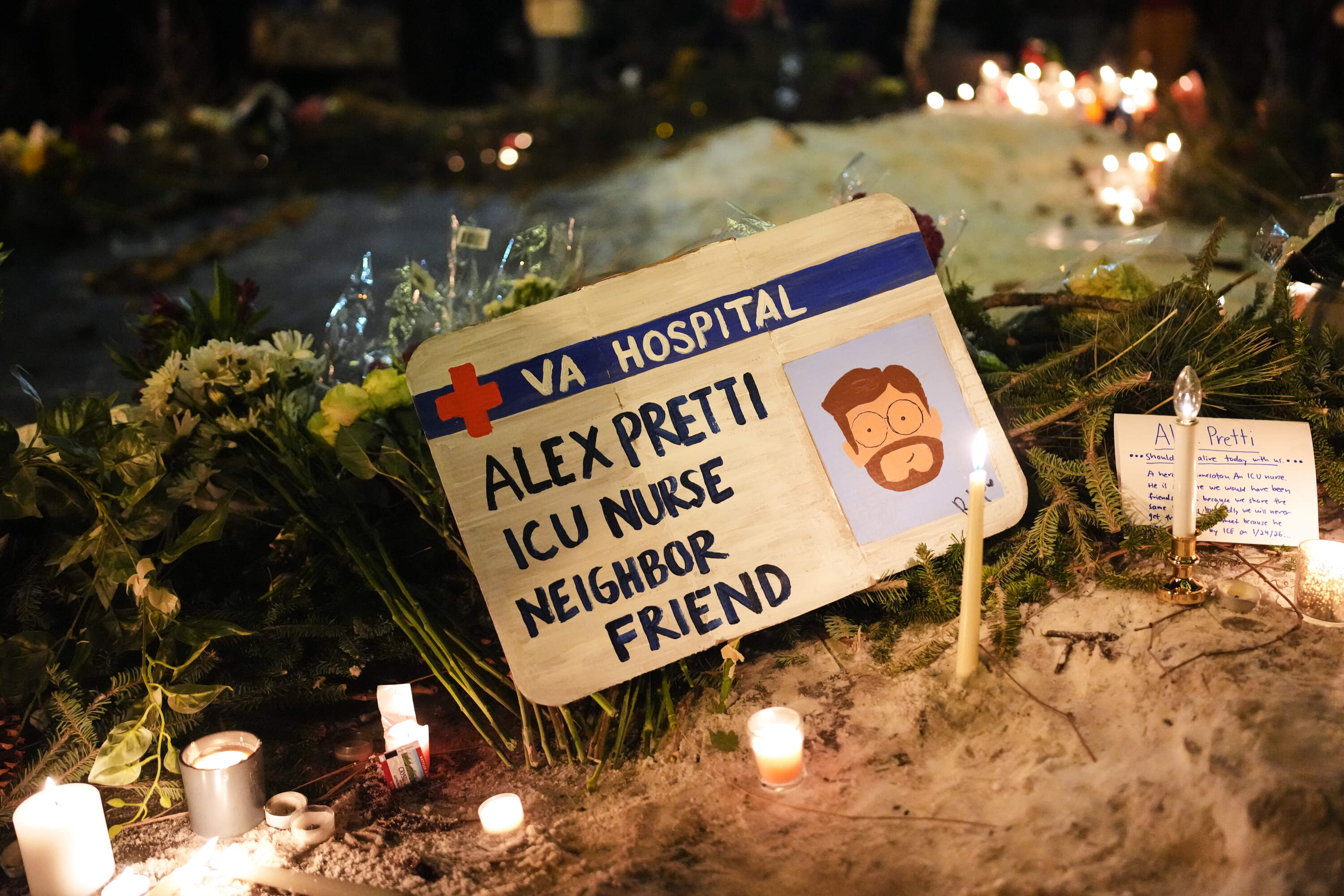 A protest sign in honor of Alex Pretti, the 37-year-old VA nurse who was shot and killed by a U.S. Border Patrol agent Saturday in Minneapolis. (Adam Gray/AP)