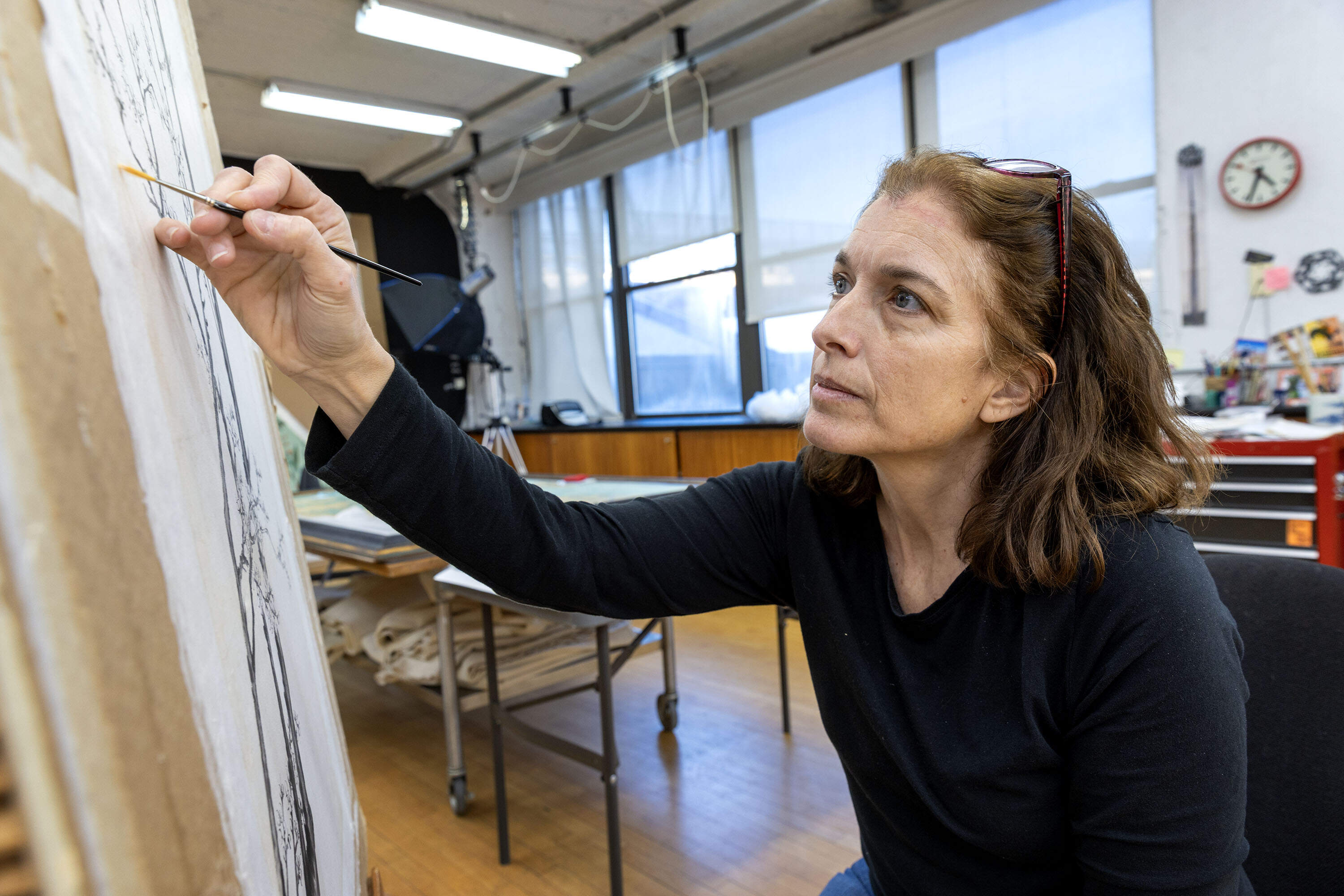 Conservator Deborah LaCamera at work at Studio TKM in Somerville. (Robin Lubbock/WBUR)