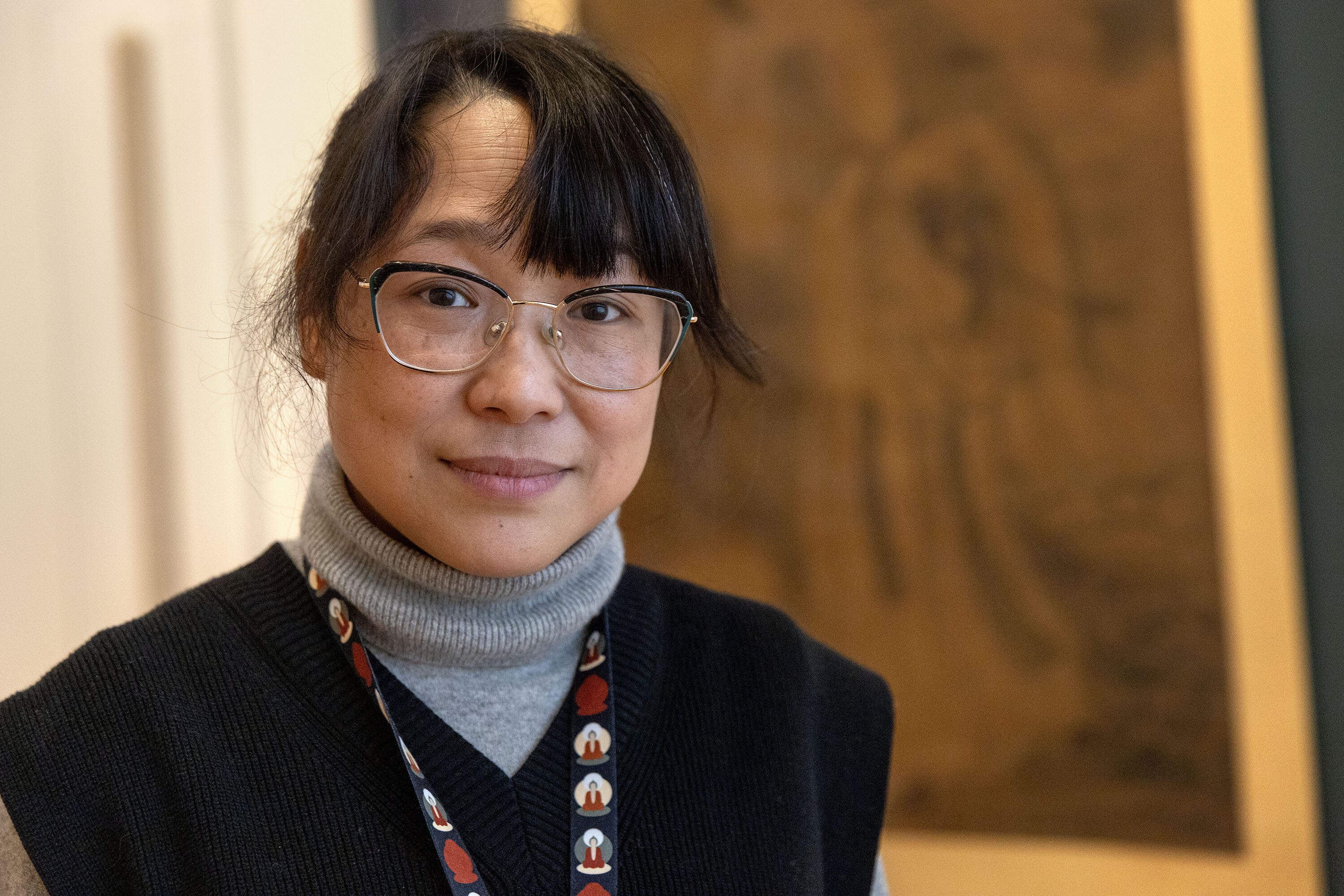 Curator Yuhua Ding at the "The Immortal Magu: A Sixteenth Century Painting Up Close" exhibition at the Davis Museum at Wellesley College, Massachusetts. (Robin Lubbock/WBUR)