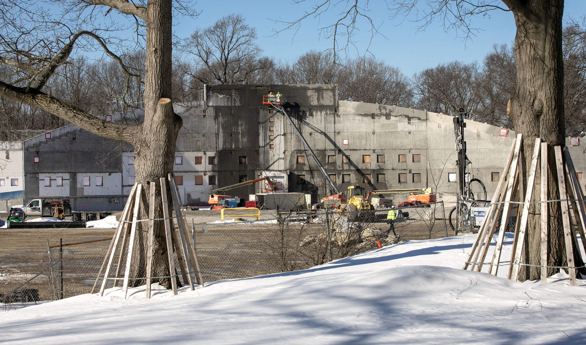 Construction workers at the site of the rebuild of White Stadium in Boston. (Robin Lubbock/WBUR)