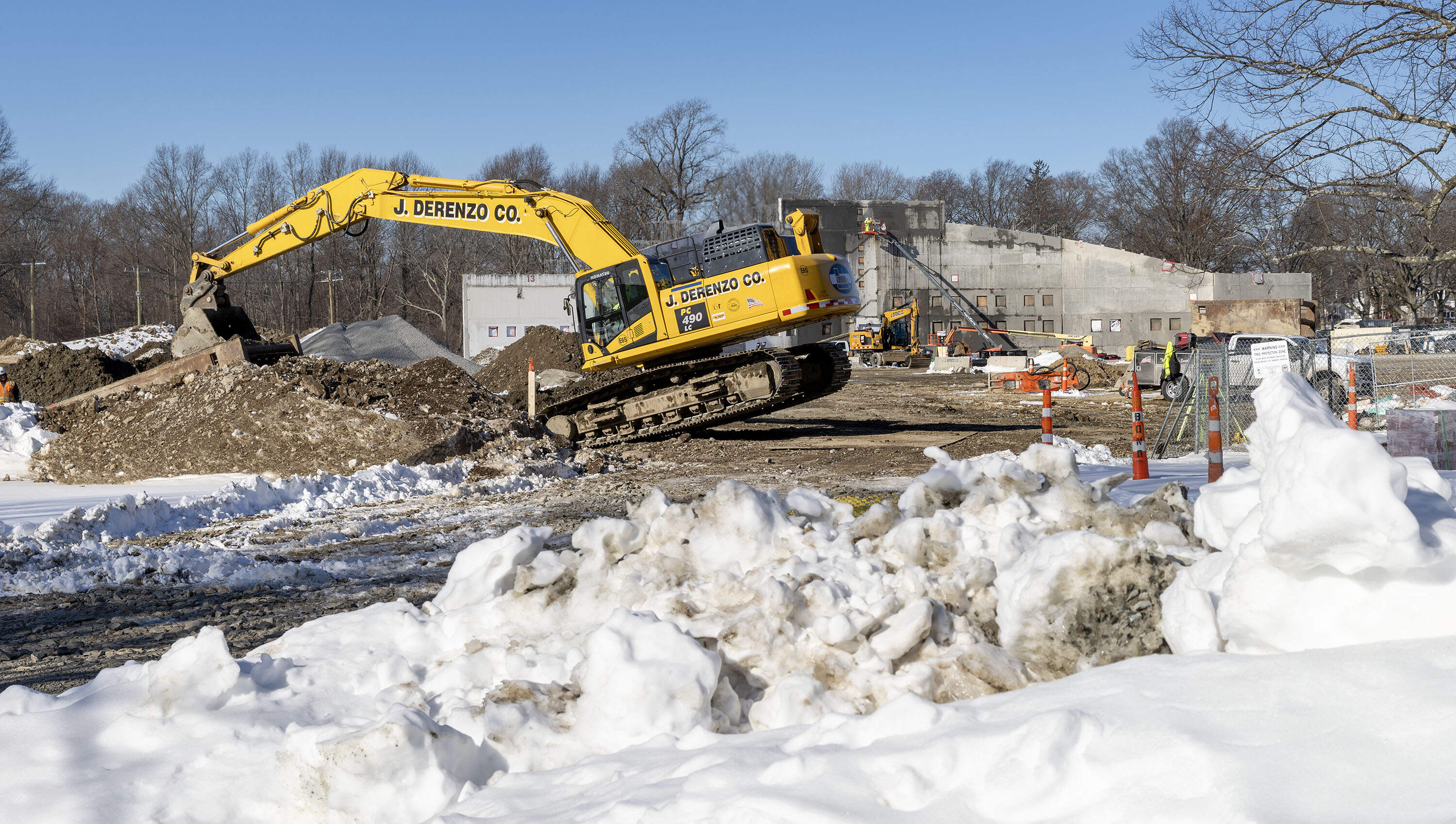 Workers at the construction site of White Stadium in Franklin Park in Boston. (Robin Lubbock/WBUR)
