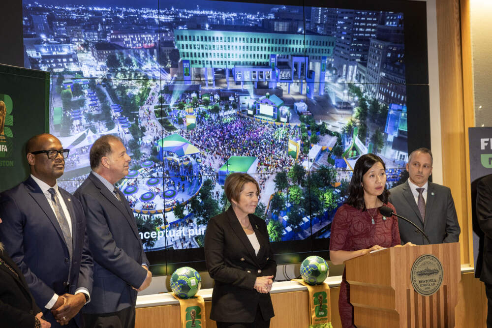 Mayor Michelle Wu stands in front of an impression of what the FIFI watch party events may look like in City Hall Plaza this summer. (Robin Lubbock/WBUR)