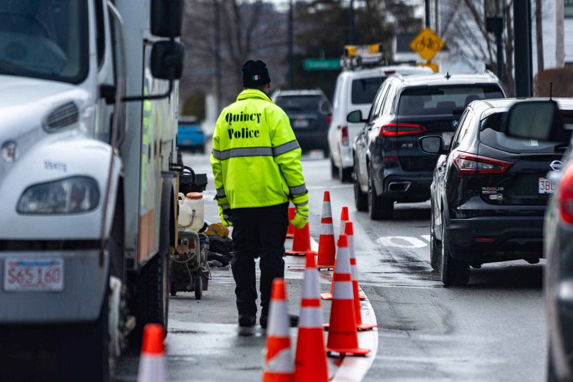 A Quincy police officer works a construction detail on Sea Street in Quincy. (Jesse Costa/WBUR)