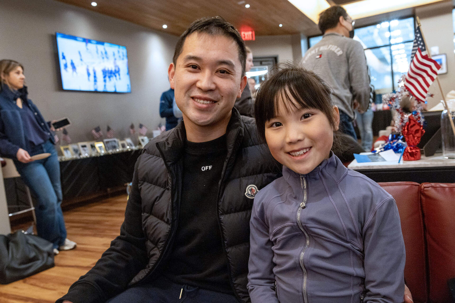Jing Tu and his daughter Iris at the Skating Club of Boston to watch Olympic skating in Milan. (Robin Lubbock/WBUR)
