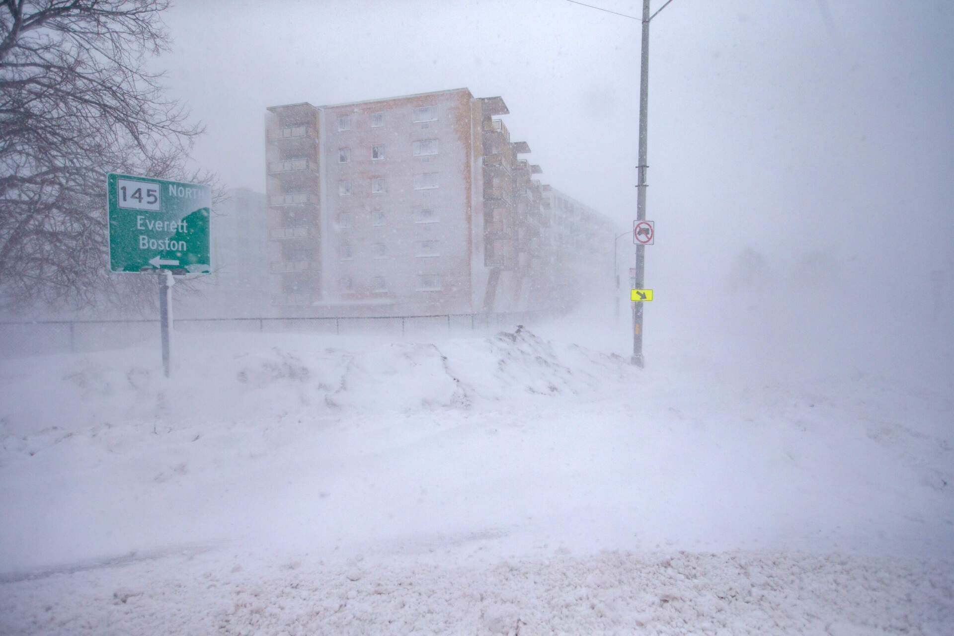 The nor’easter whips snow across Eliot Circle creating whiteout conditions looking down Revere Beach Boulevard. (Jesse Costa/WBUR)