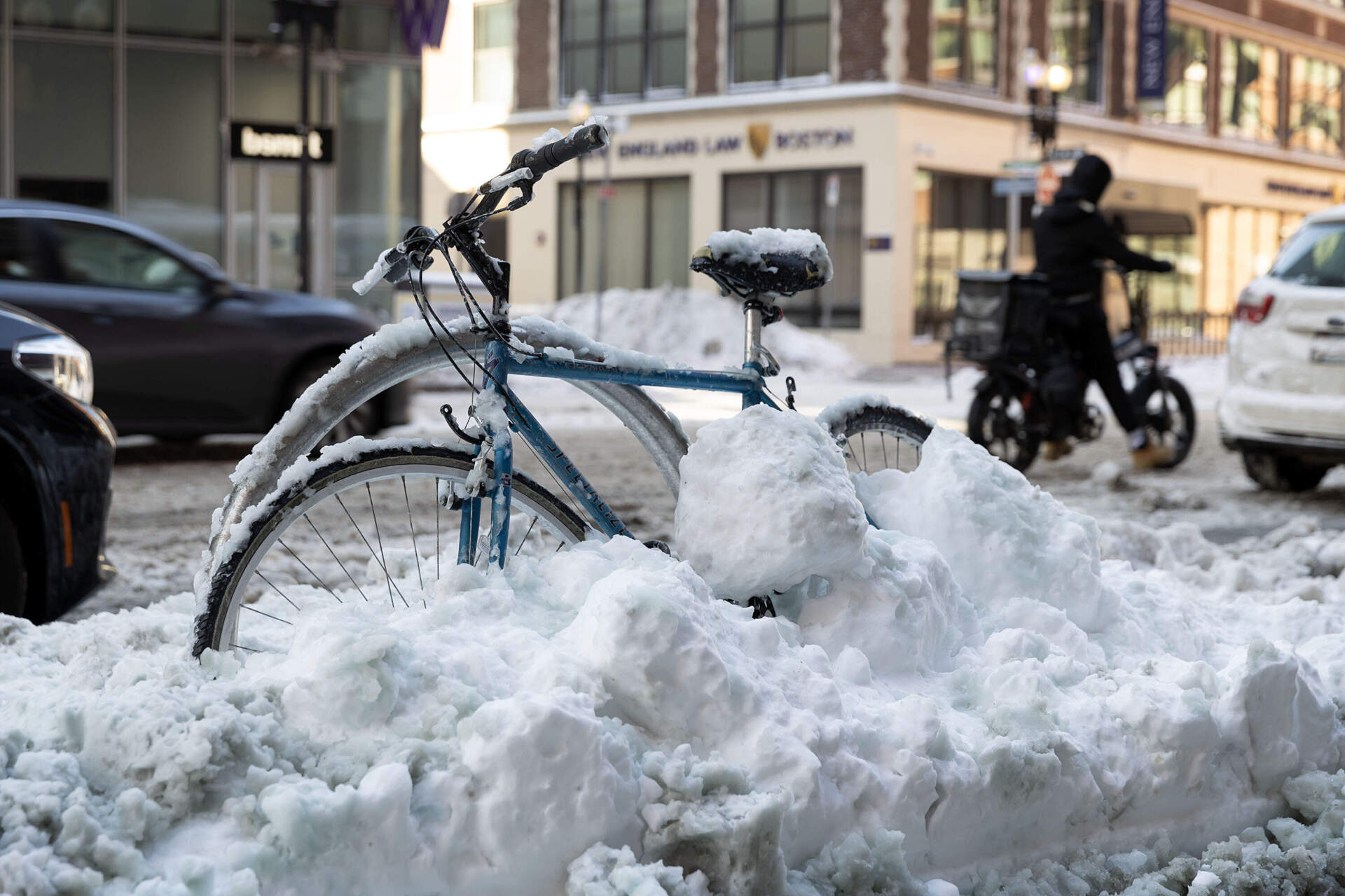 A frozen bicycle on Charles St. in downtown Boston, waits to be dug out by its owner, Feb. 24, 2026. (Robin Lubbock/WBUR)