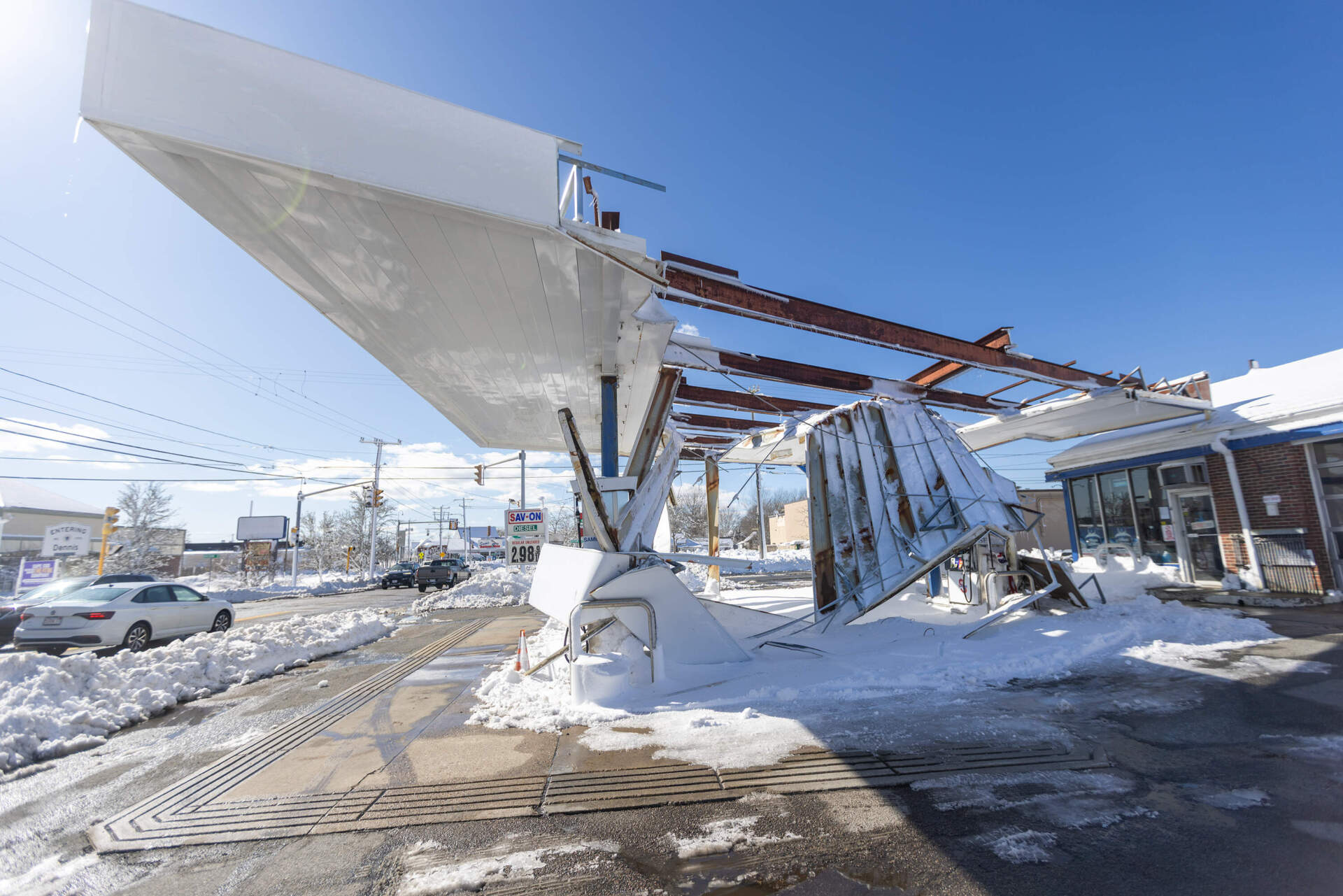 The roof of the Savon gas station on Route 28 in Harwich collapsed from the weight of the snow during Monday's storm. (Jesse Costa/WBUR)