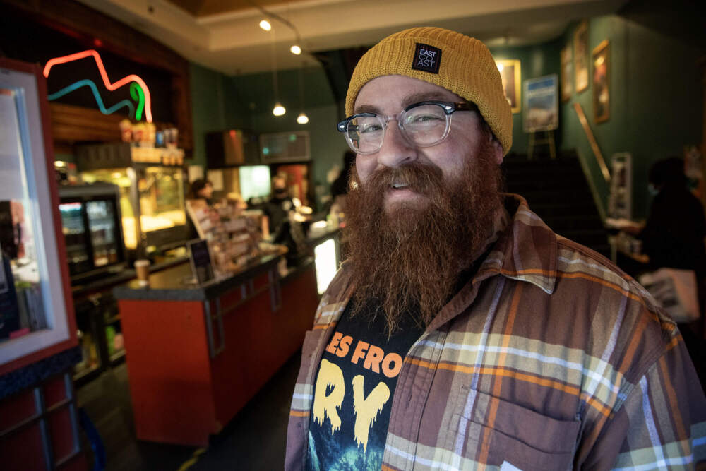 Coolidge Corner Theatre artistic director Mark Anastasio stands in the cinema's old foyer. (Robin Lubbock/WBUR)