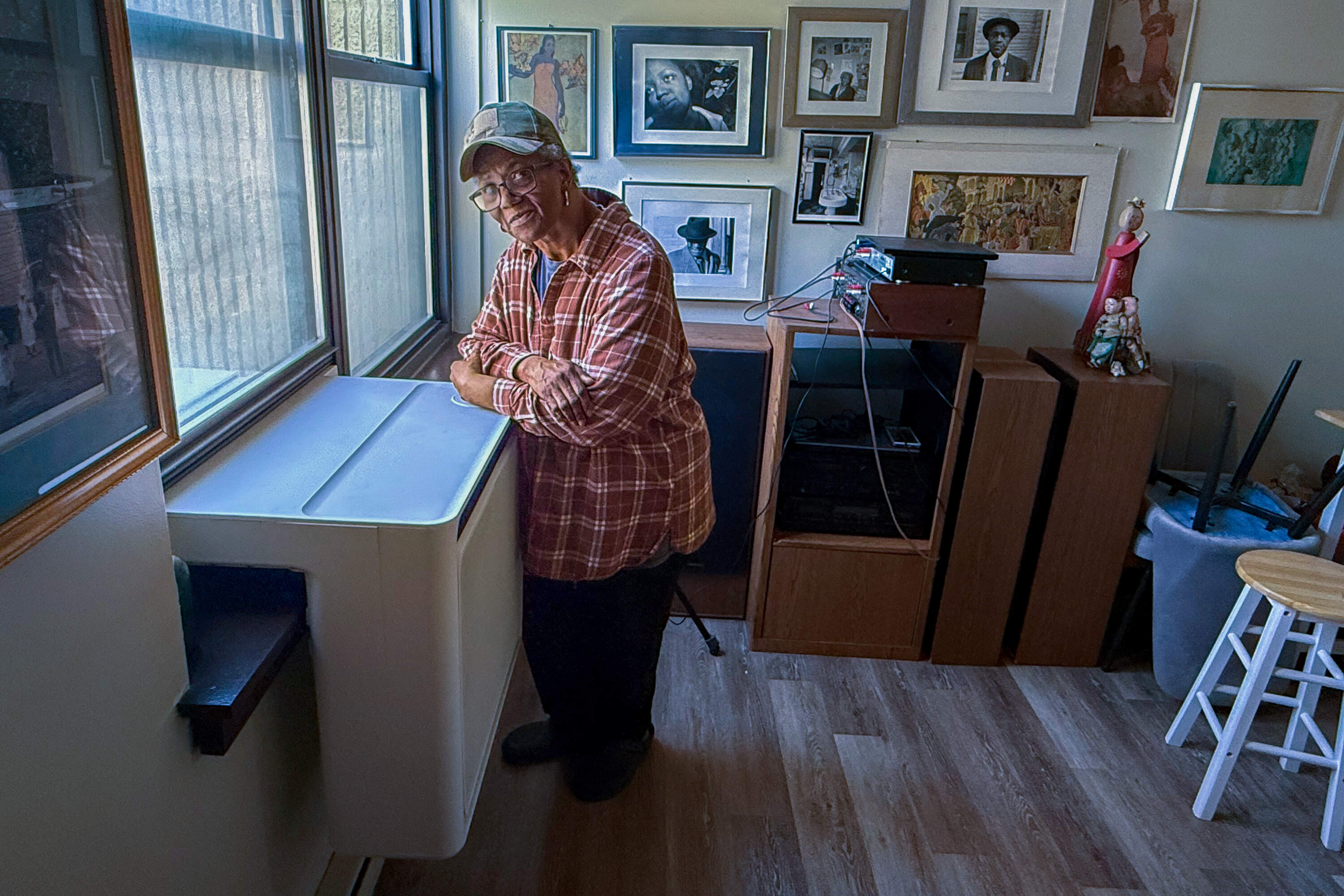 Wenda Dotton shows off the new Gradient heat pump in her apartment. (Courtesy of the Boston Housing Authority)