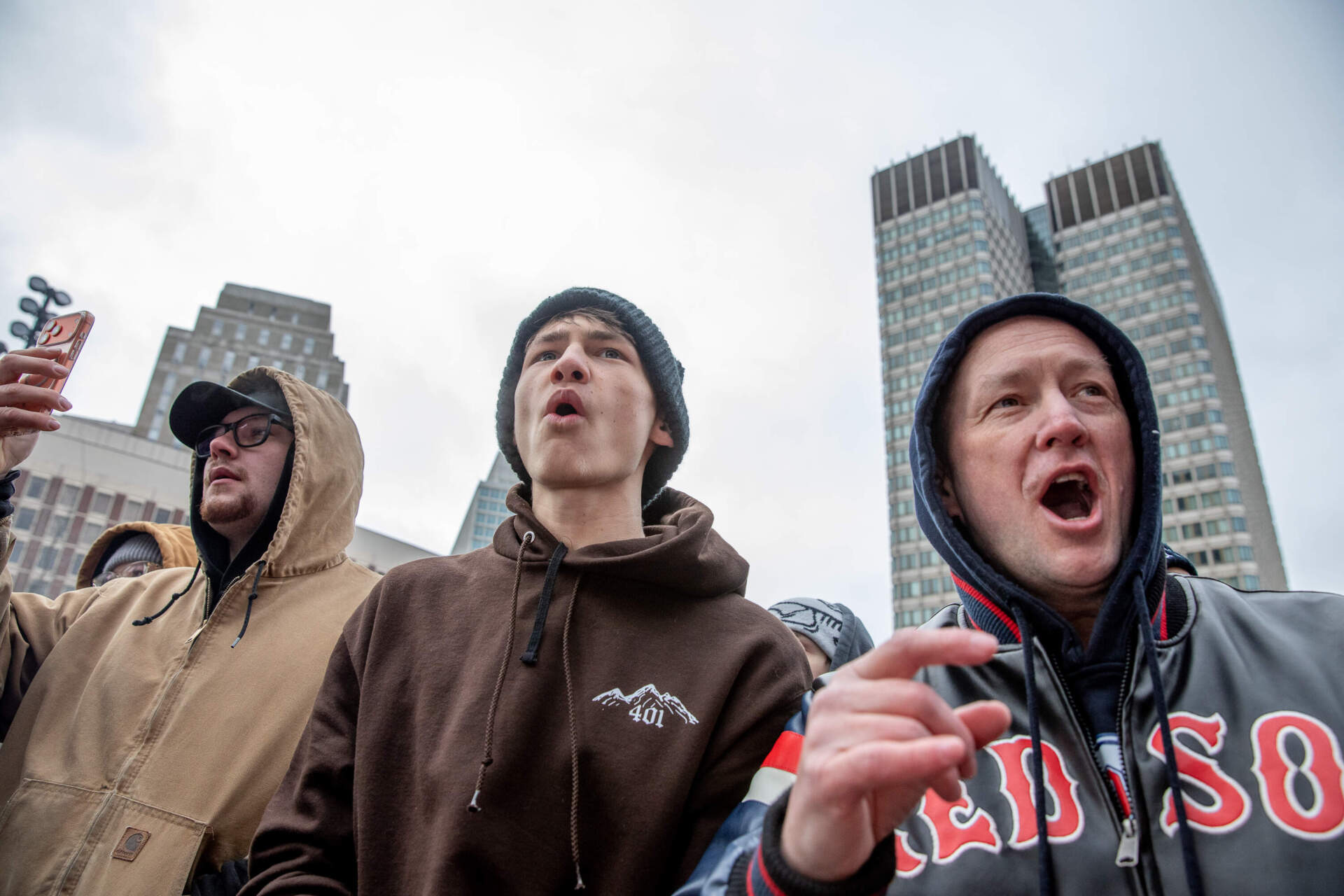 Ethan Harley (center) and Chris Harley (right) arrived four hours early to secure a front row spot at the 2026 Red Bull Heavy Metal Finals. (Artemisia Luk/WBUR)