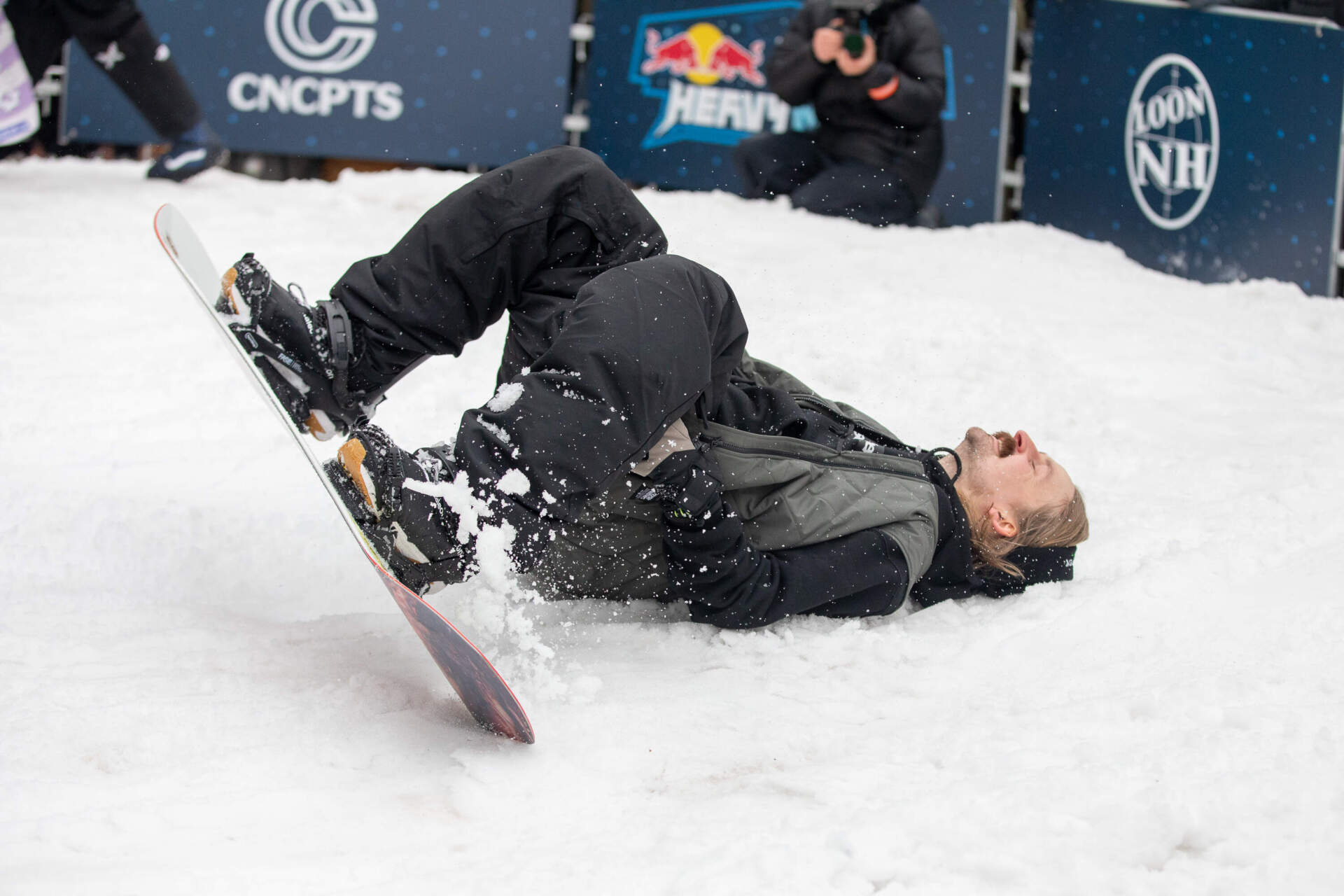 Snowboarder Halldor Helgason takes a fall during the Zone 1 competition. (Artemisia Luk/WBUR)
