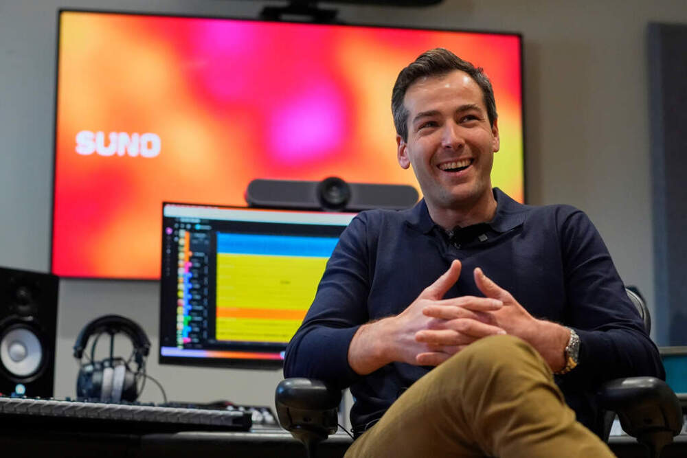 Mikey Shulman, one of the founders of AI music generator startup Suno, speaks to a reporter at company headquarters, Tuesday, Jan. 13, 2026, in Cambridge, Mass. (Robert F. Bukaty/AP)