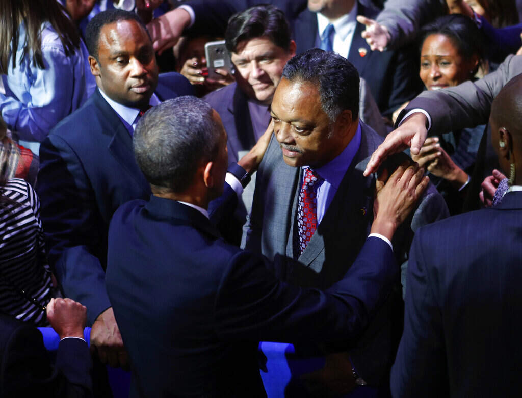 President Barack Obama talks with Rev. Jesse Jackson following his farewell address at McCormick Place in Chicago, Tuesday, Jan. 10, 2017. On the left is Jackson's son Jonathan Jackson. (Pablo Martinez Monsivais/ AP)