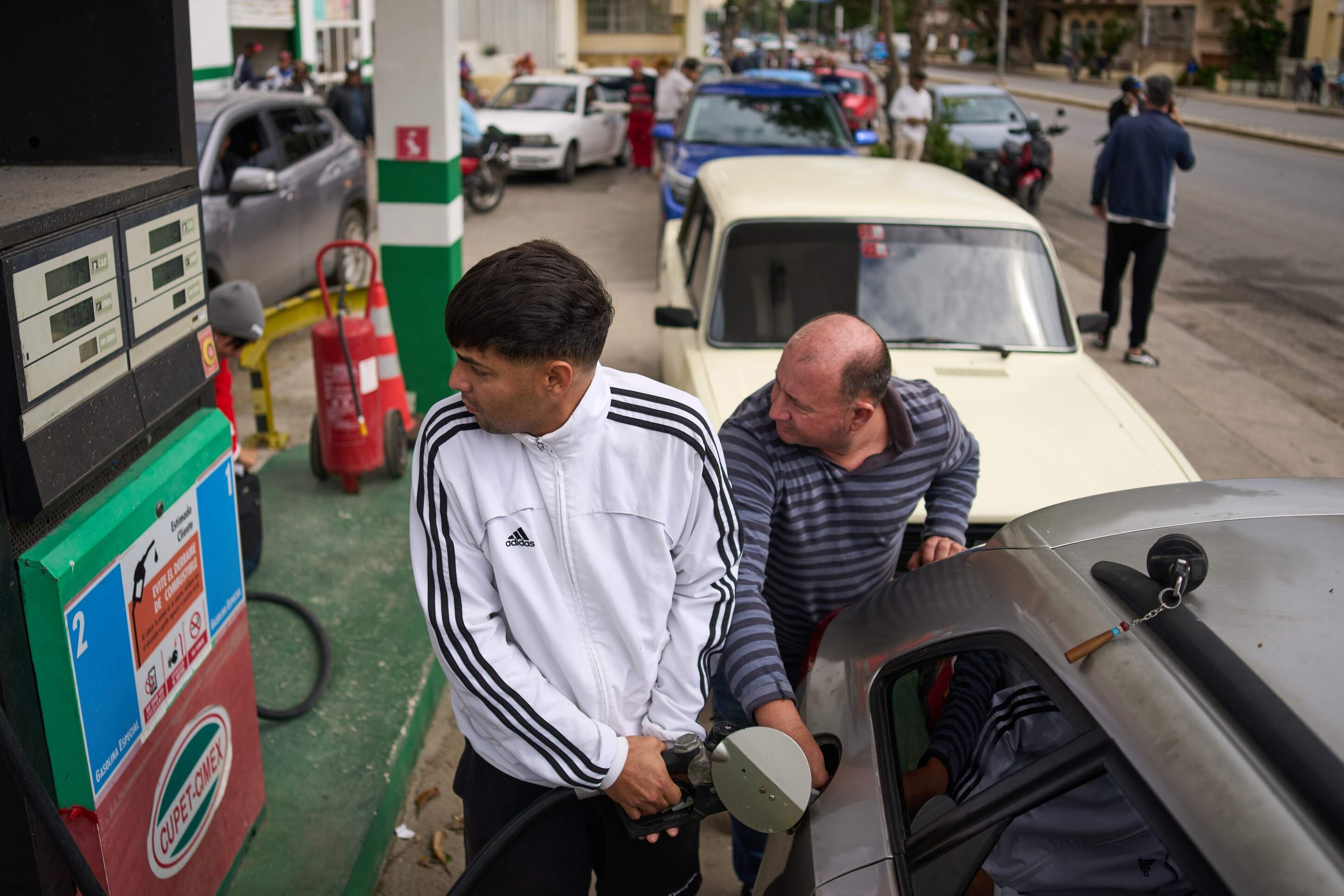 A driver refuels at a gas station as others wait behind in a long line in Havana, Cuba, Friday, Jan. 30, 2026. (Ramon Espinosa/AP)