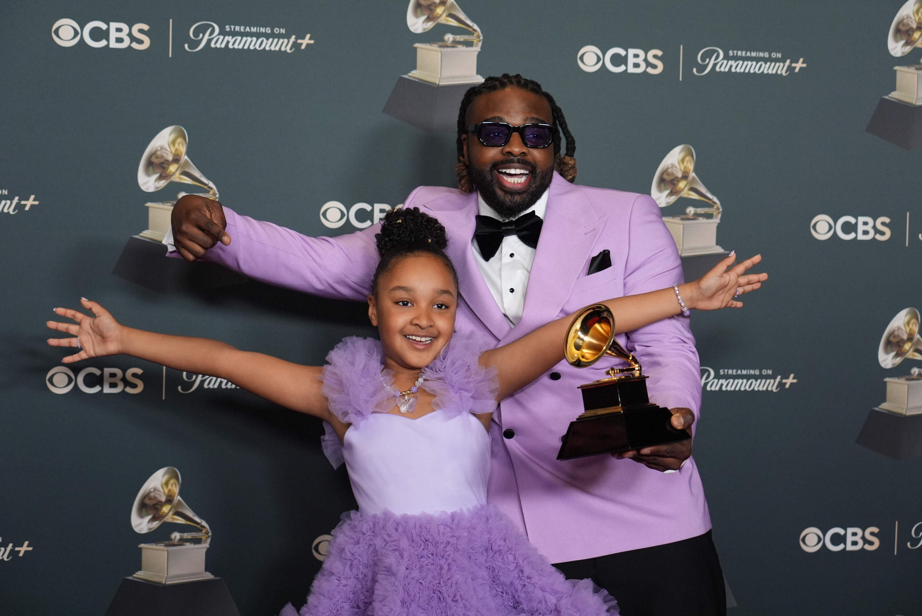 Aura V, left, and Fyütch pose in the press room with the award for best children's music album for "Harmony" during the 68th annual Grammy Awards on Sunday, Feb. 1, 2026, in Los Angeles. (Richard Shotwell/Invision/AP)