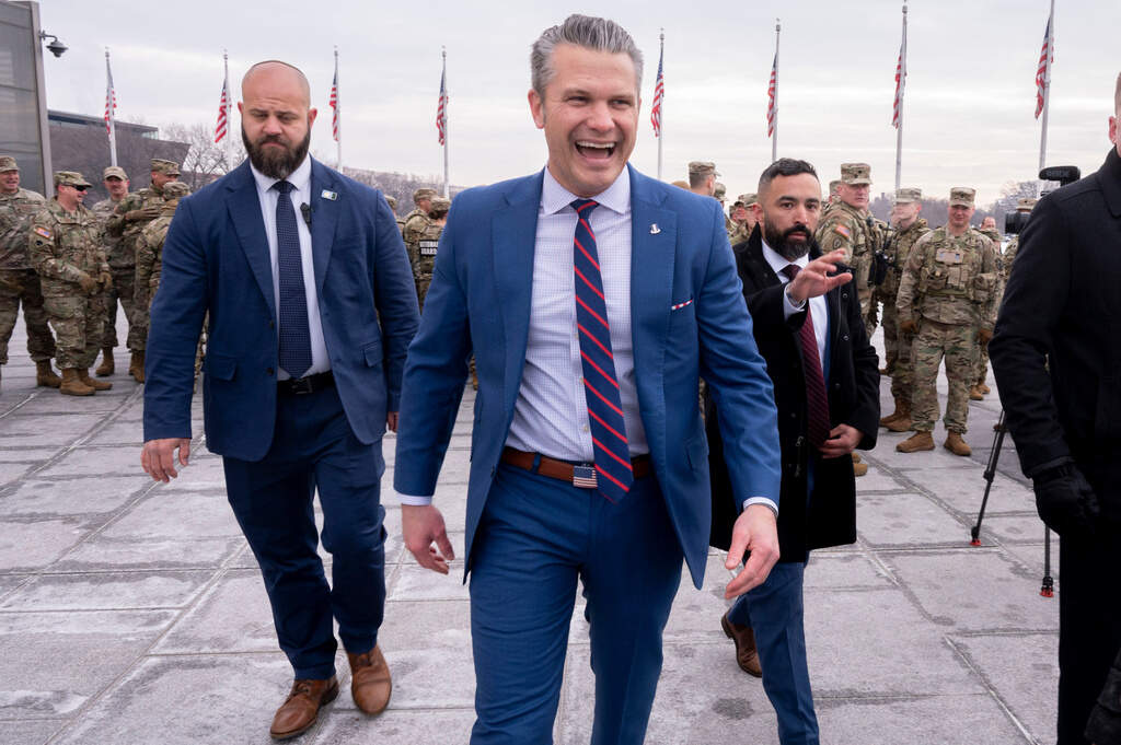 Defense Secretary Pete Hegseth leaves an oath of enlistment ceremony, Friday, Feb. 6, 2026, held on the base of the Washington Monument in Washington. (AP Photo/Kevin Wolf)