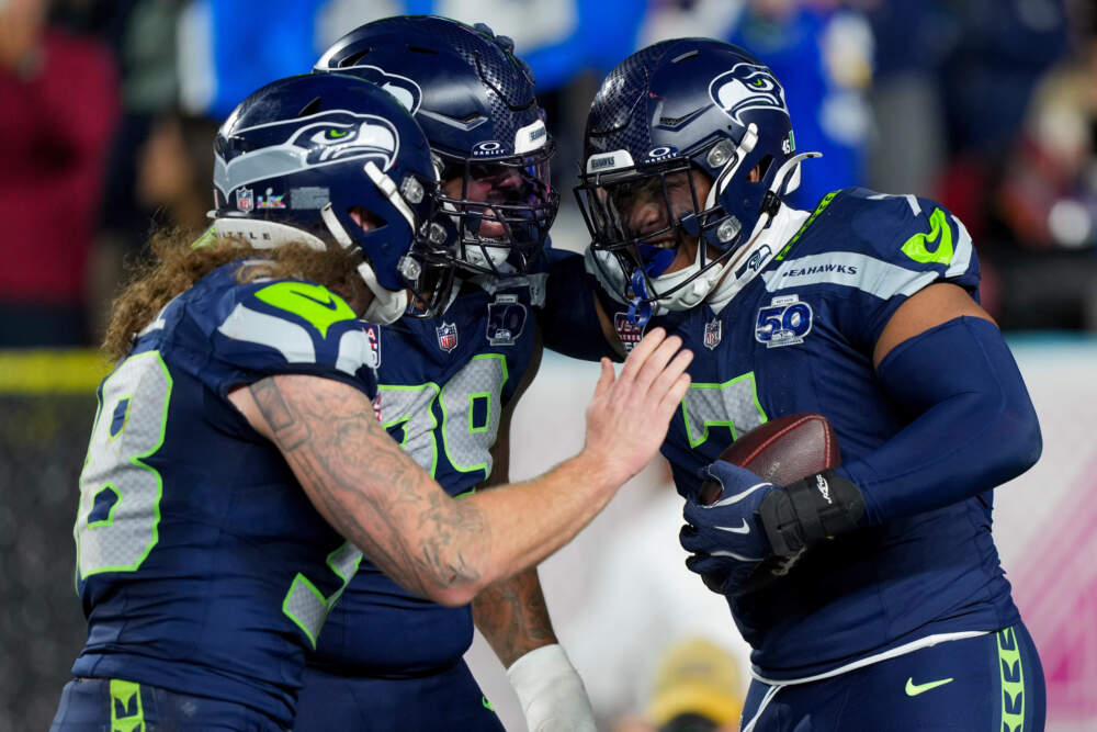 Seattle Seahawks linebacker Uchenna Nwosu, right, is congratulated by teammates after recovering a fumble and returning it for a touchdown during the second half of the NFL Super Bowl 60 football game against the New England Patriots, Sunday, Feb. 8, 2026, in Santa Clara, Calif. (Brynn Anderson/AP)