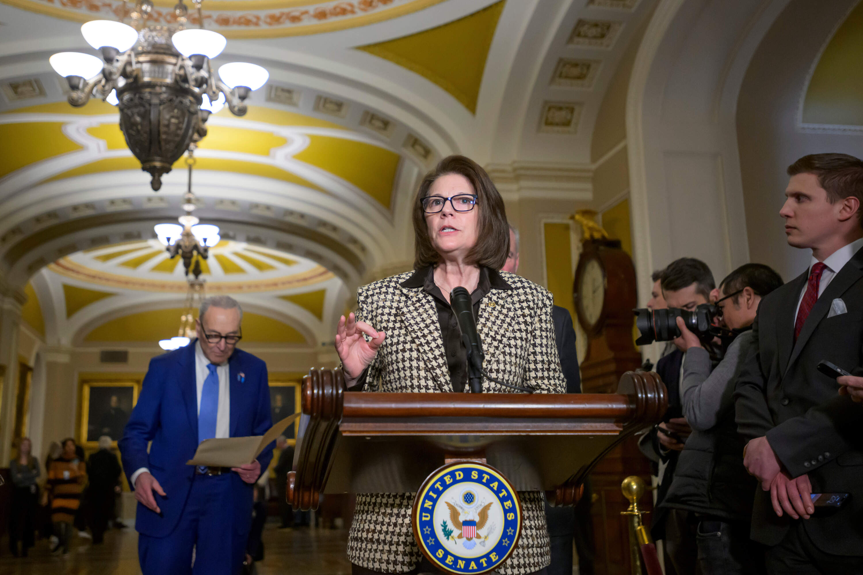 Sen. Catherine Cortez Masto, D-Nev.., speaks as Senate Minority Leader Chuck Schumer, D-N.Y., left, listens during the Senate Democrat policy luncheon news conference at the Capitol, Tuesday, Feb., 10, 2026, in Washington. (Rod Lamkey, Jr./AP)