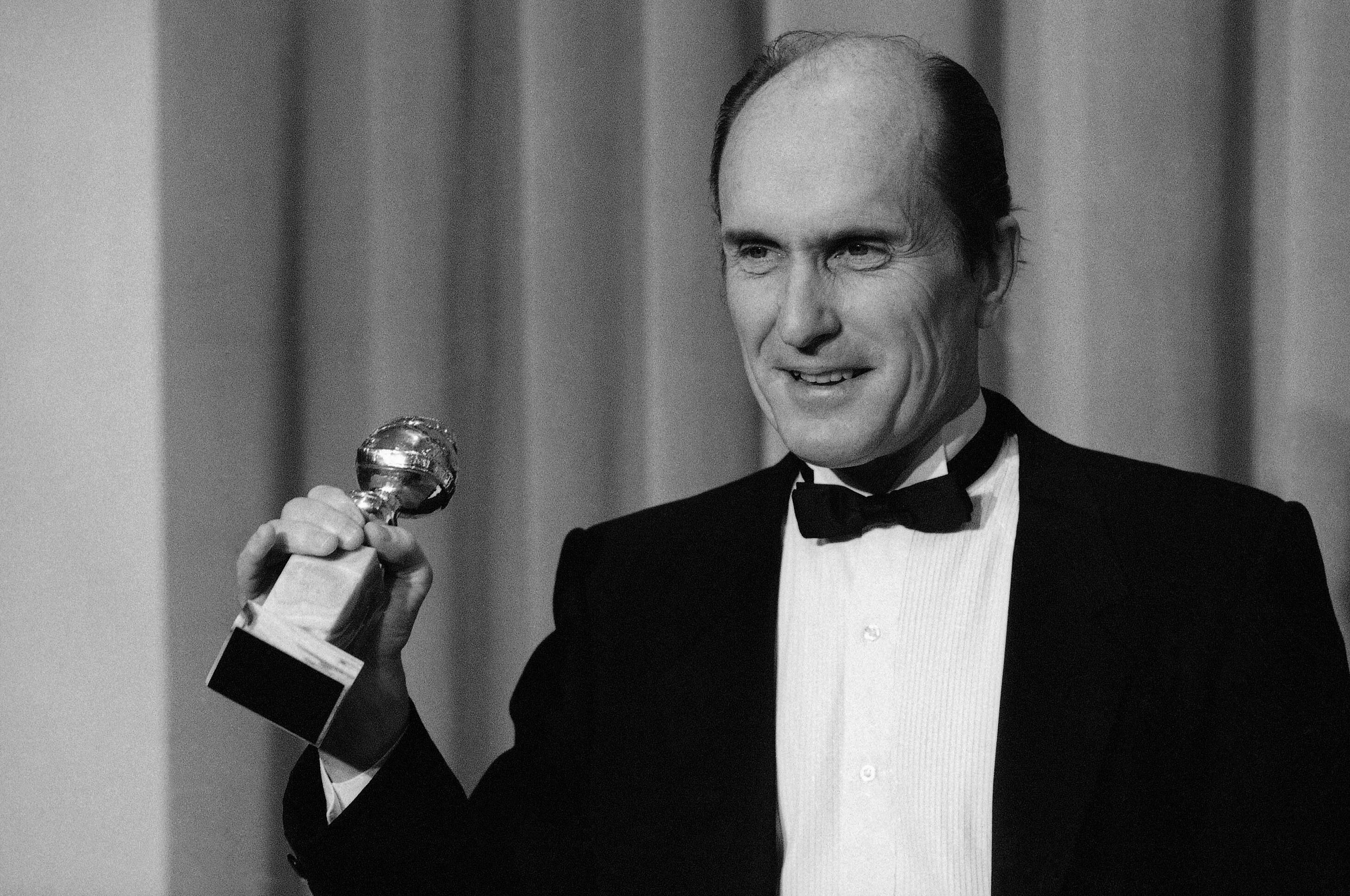 Actor Robert Duvall holds the Golden Globe award he won in Beverly Hills, Calif. January 29, 1984 for best actor in a dramatic motion picture, "Tender Mercies." (Lennox Mclendon/AP)