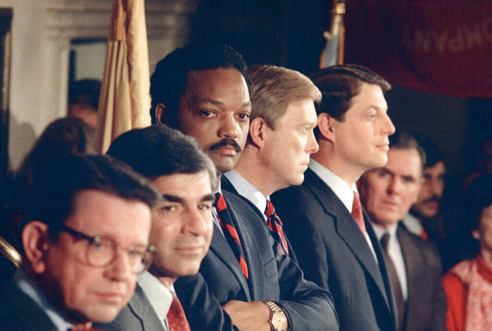 Democratic presidential candidates, from left, Sen. Paul Simon, Mass. Gov. Michael Dukakis, Jesse Jackson, Rep. Richard Gephardt and Sen. Albert Gore listen as Gary Hart, (not shown) answers a question following their debate at Faneuil Hall, Boston, Jan. 26, 1988. (Jim Gerberich/ AP)