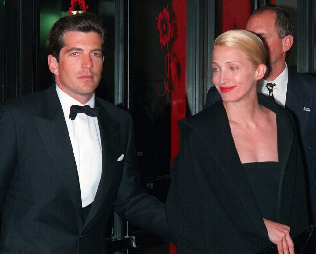 In a file photo John F. Kennedy, Jr. and his wife, Carolyn Bessette Kennedy, arrive at the Minskoff Theatre Monday night, April 6, 1998. (Mitch Jacobson/AP)