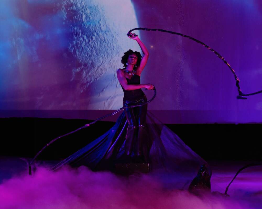 Dancer and model Patrice Anne in a promotional image for Afrofuturistic hair and fashion show "Cosmic Roots." (Courtesy Najee Visuals)
