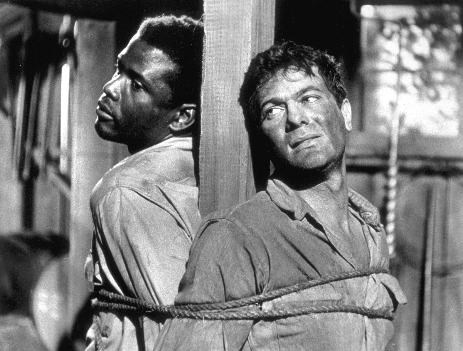 From left, Sidney Poitier and Tony Curtis in "The Defiant Ones." (Courtesy United Artists/Photofest)
