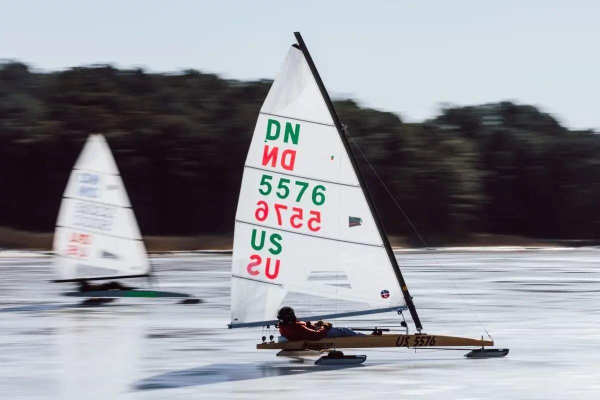 Ice boat racer and sailor, Ray Gauthier, 72, sails across the ice at Claiborne Cove, in Claiborne, Md., on Monday. The unusually long stretch of subfreezing temperatures created optimal conditions in an area where the water rarely freezes. (Wesley Lapointe for NPR)