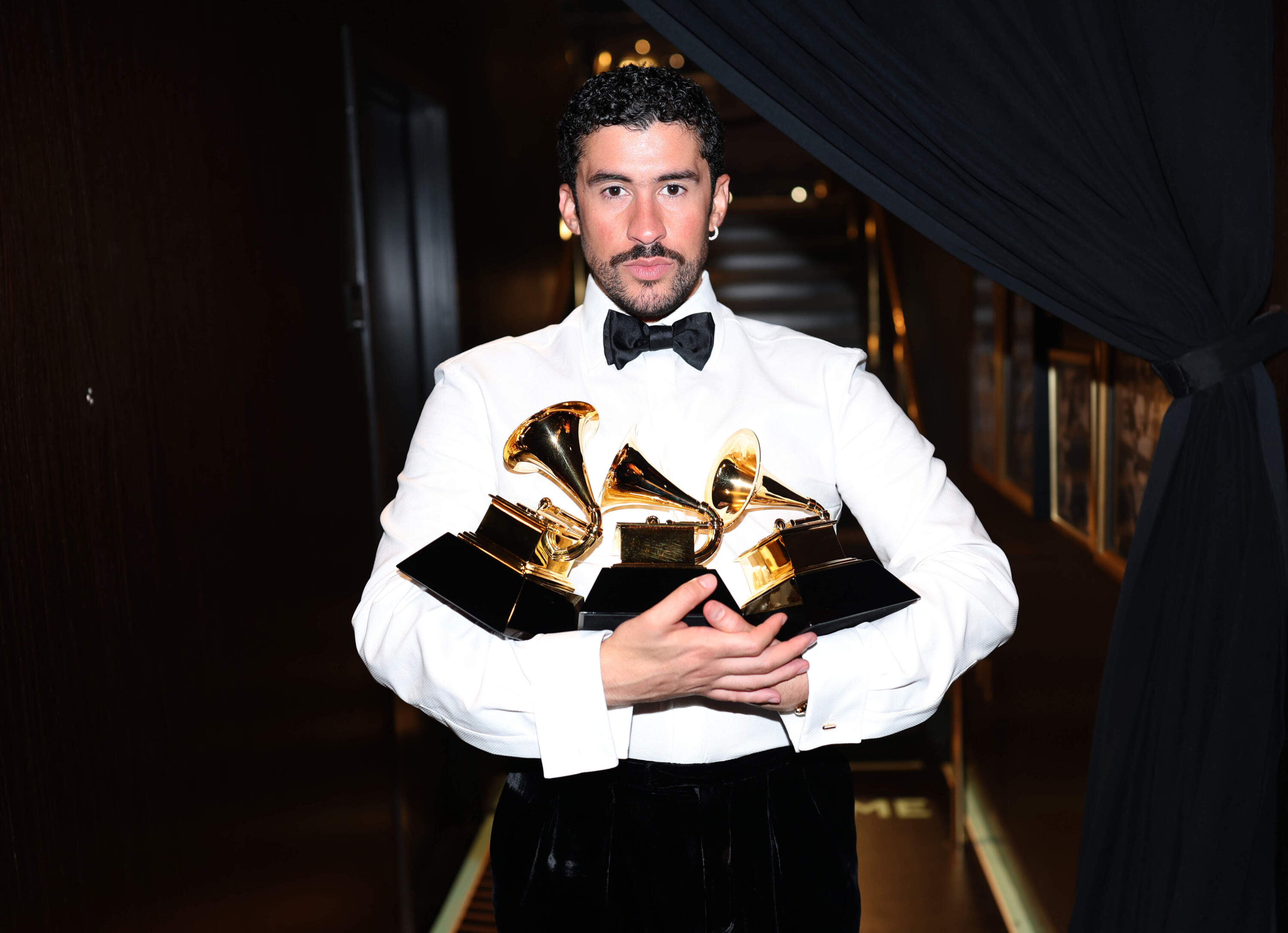 Bad Bunny poses with the Album of the Year, Best Música Urbana Album, and Best Global Music Performance Awards during the 68th GRAMMY Awards at Crypto.com Arena on Feb. 01, 2026 in Los Angeles, California. (Matt Winkelmeyer/Getty Images for The Recording Academy)