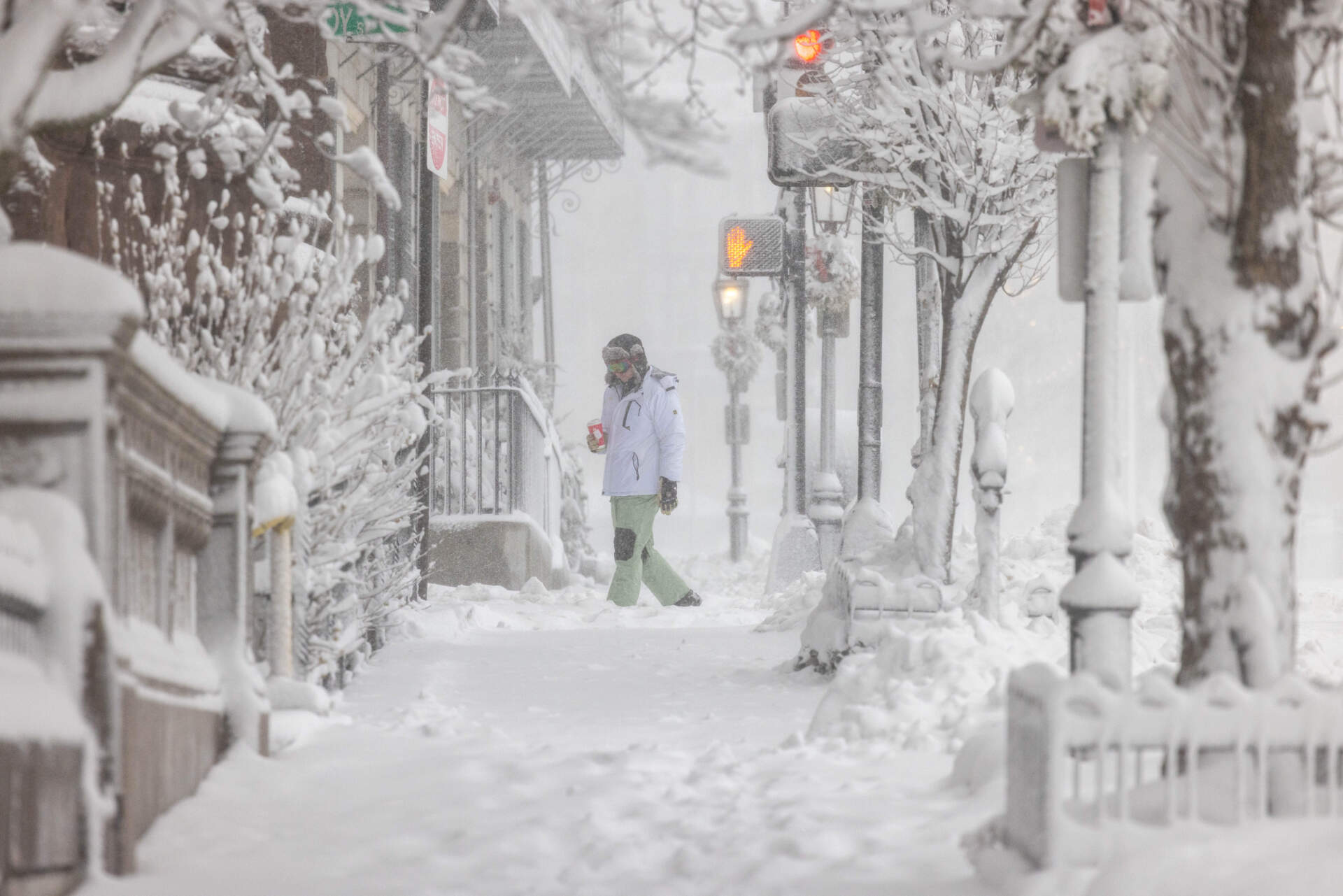 A person walks through Boston during a heavy snow on Monday. (Scott Eisen/Getty Images)