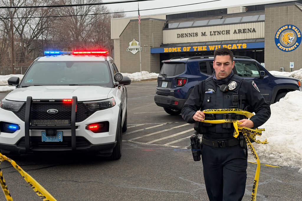 Police tape off the Dennis M. Lynch arena a day after a deadly shooting during a youth hockey game on Tuesday, Feb. 17, 2026 in Pawtucket, R.I. (Rodrique Ngowi/AP)