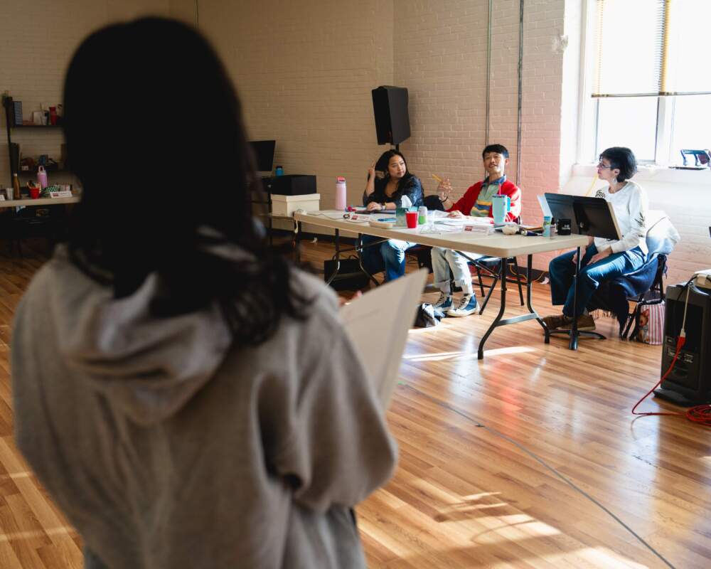 From left: Pichanny Som, Maylee You, playwright Vichet Chum and director Pirronne Yousefzadeh in rehearsal for Merrimack Repertory Theatre's "Kween." (Courtesy 41st Casanova Productions)