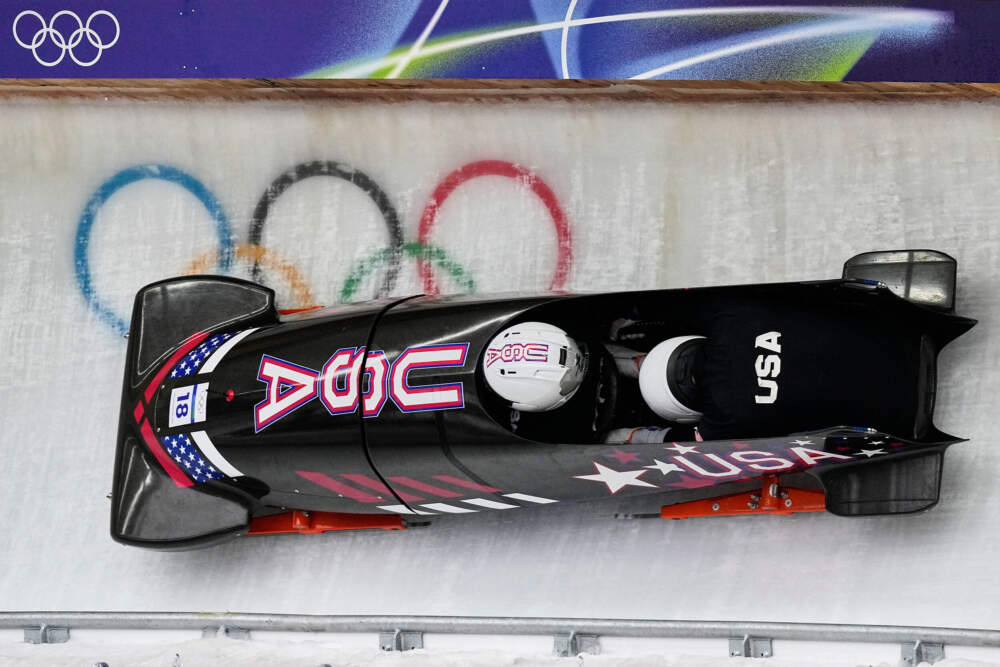 United States' Frank del Duca, left, slides down the track during a two man bobsled training session at the 2026 Winter Olympics, in Cortina d'Ampezzo, Italy, Saturday, Feb. 14, 2026. (Aijaz Rahi/AP)