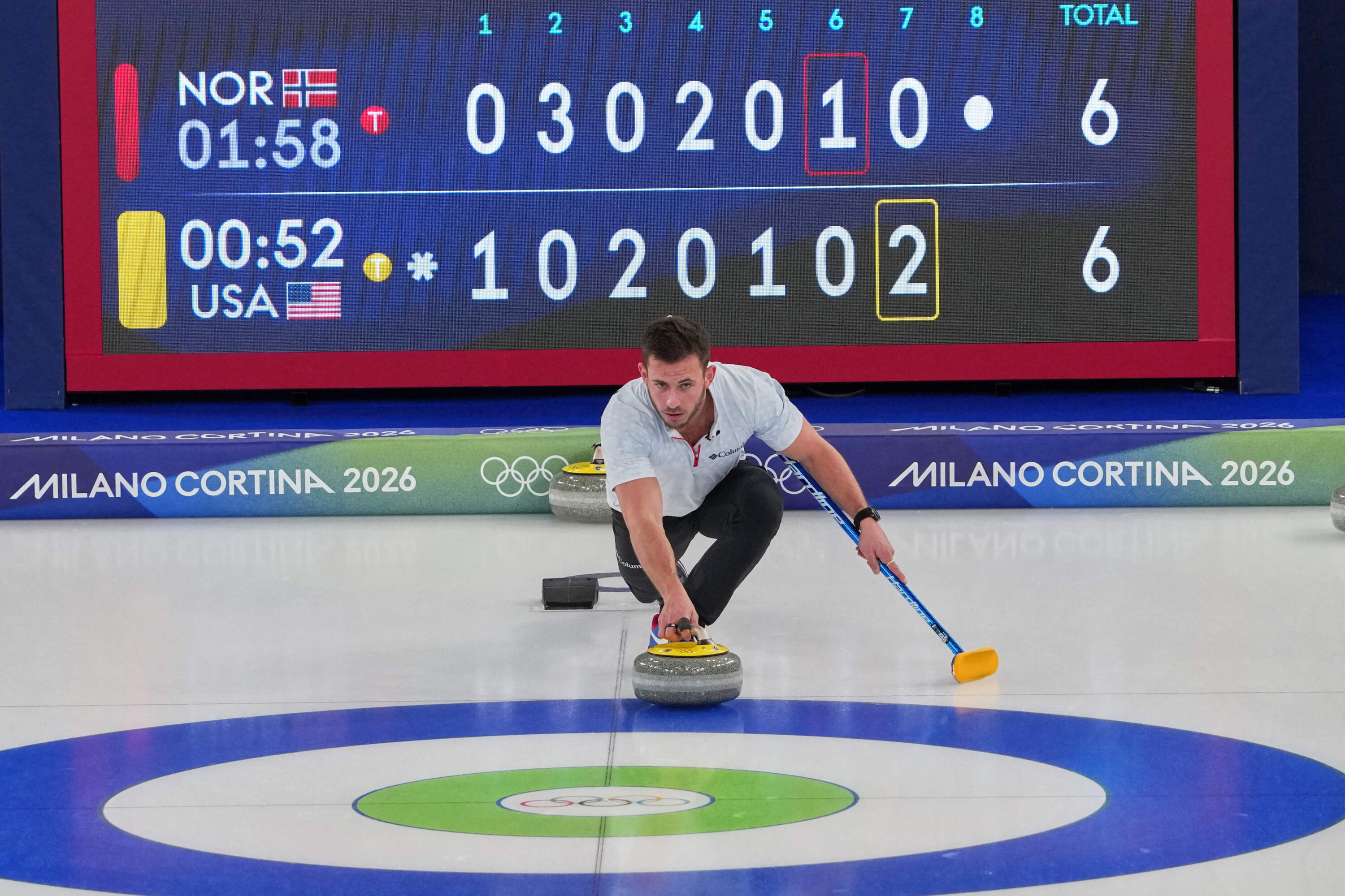 American curler Korey Dropkin in action Thursday during the mixed doubles round robin phase of the competition against Norway at the 2026 Winter Olympics in Cortina d'Ampezzo, Italy.
