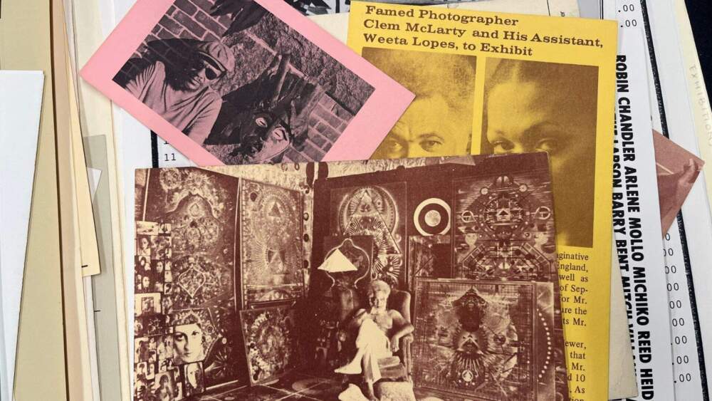 In the center, a photo of artist Clem McLarty in his Boston studio. (Courtesy Northeastern University Archives and Special Collections via Arielle Gray/WBUR)