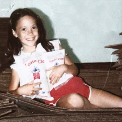 Nicole Bernard Dawes embraces a couple bags of Cape Cod Chips as a child. (Courtesy of Nicole Bernard Dawes.)