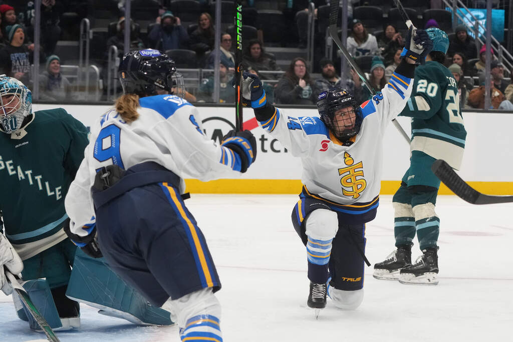 Toronto Sceptres forward Natalie Spooner celebrates a goal against Seattle Torrent goaltender Corinne Schroeder, left, during the third period of a PWHL hockey game, Tuesday, Jan. 20, 2026, in Seattle. (Lindsey Wasson/AP)