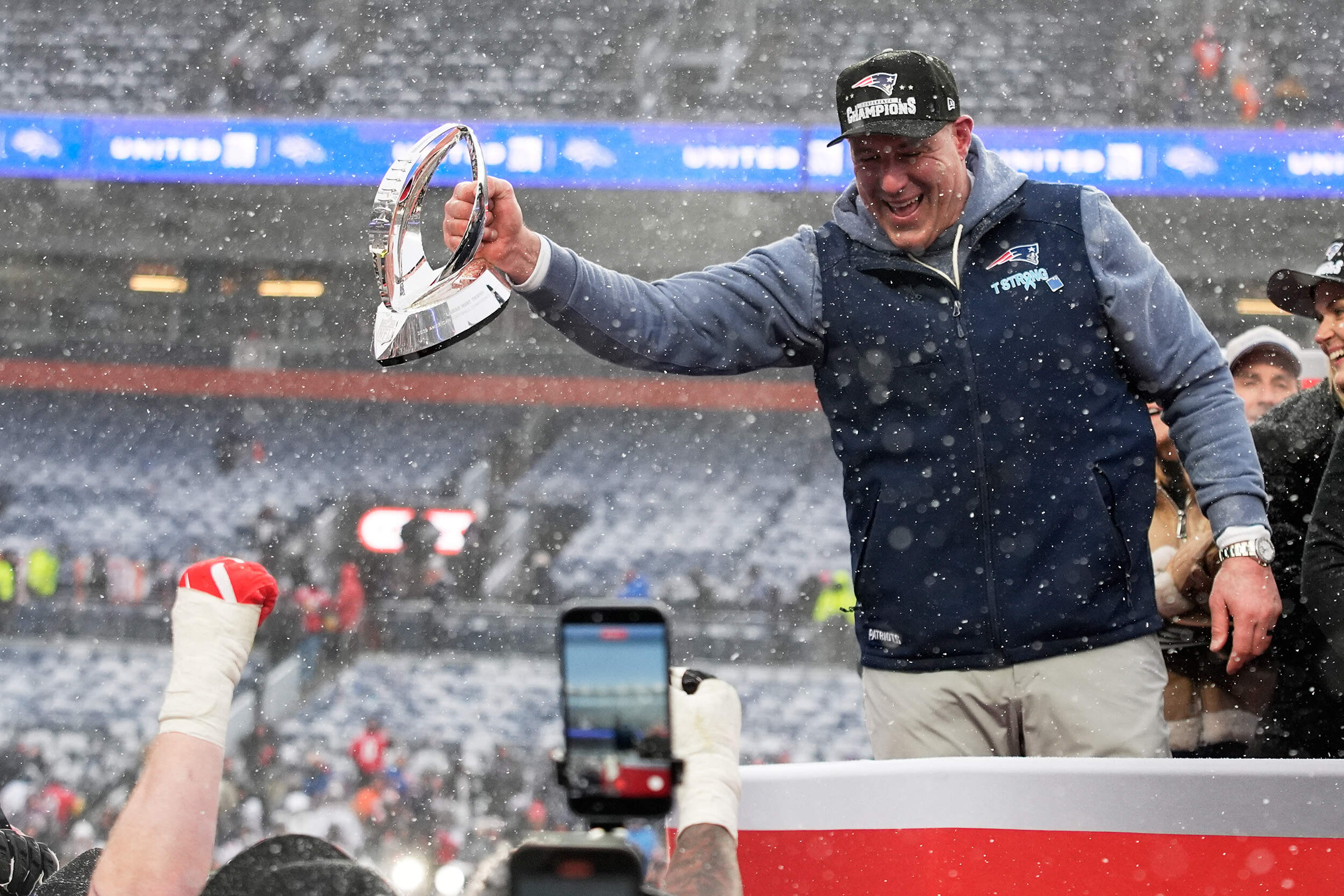 New England Patriots head coach Mike Vrabel celebrates with the trophy after the AFC Championship game, Sunday, Jan. 25, 2026, in Denver. (John Locher/AP)
