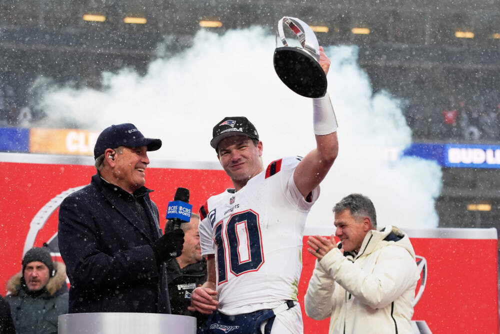 New England Patriots quarterback Drake Maye celebrates with the trophy after the AFC Championship NFL football game between the Denver Broncos and the New England Patriots on Jan. 25, 2026, in Denver. (John Locher/AP)
